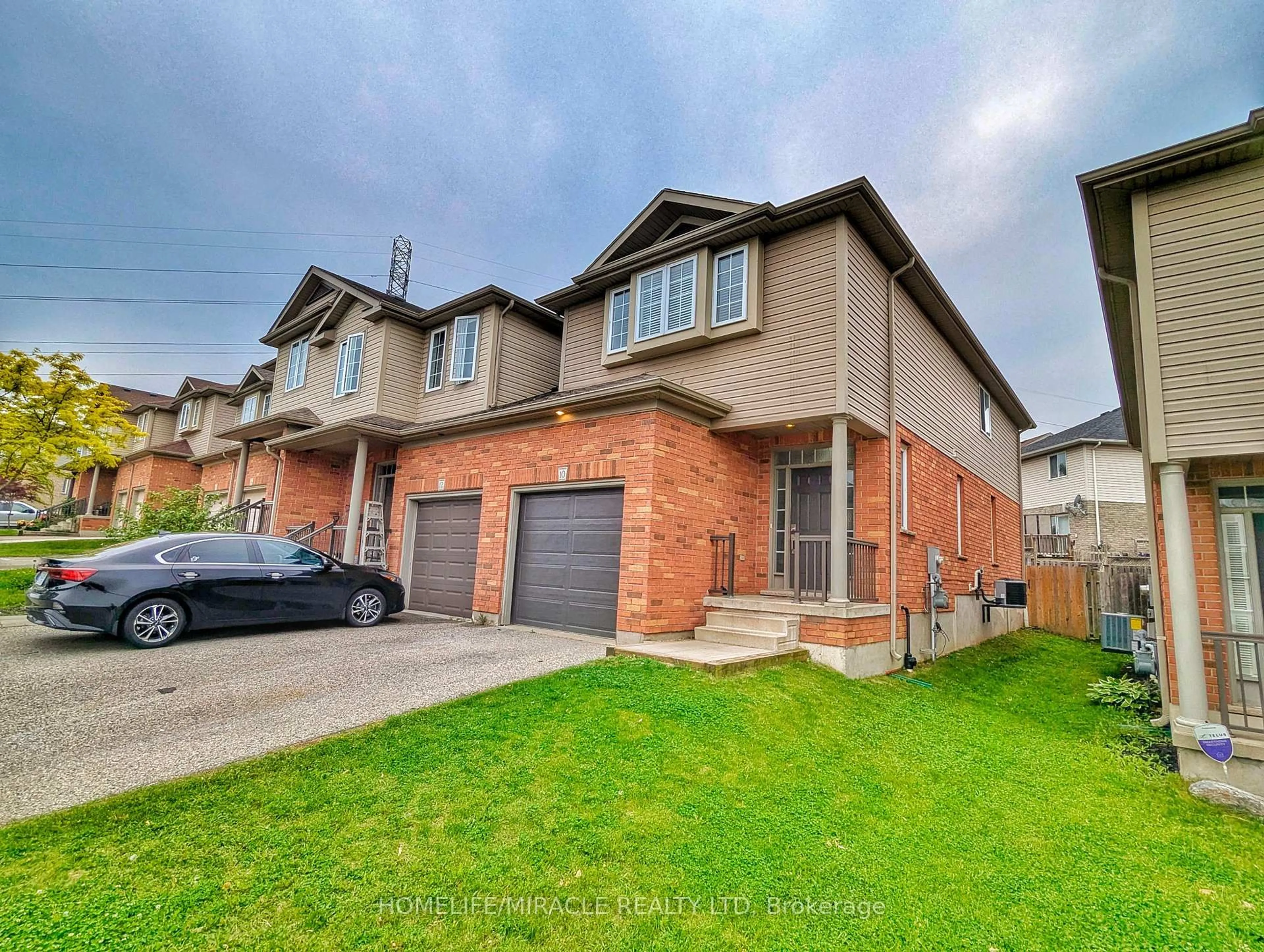 Home with brick exterior material, street for 10 Tudor St, Kitchener Ontario N2R 1W3
