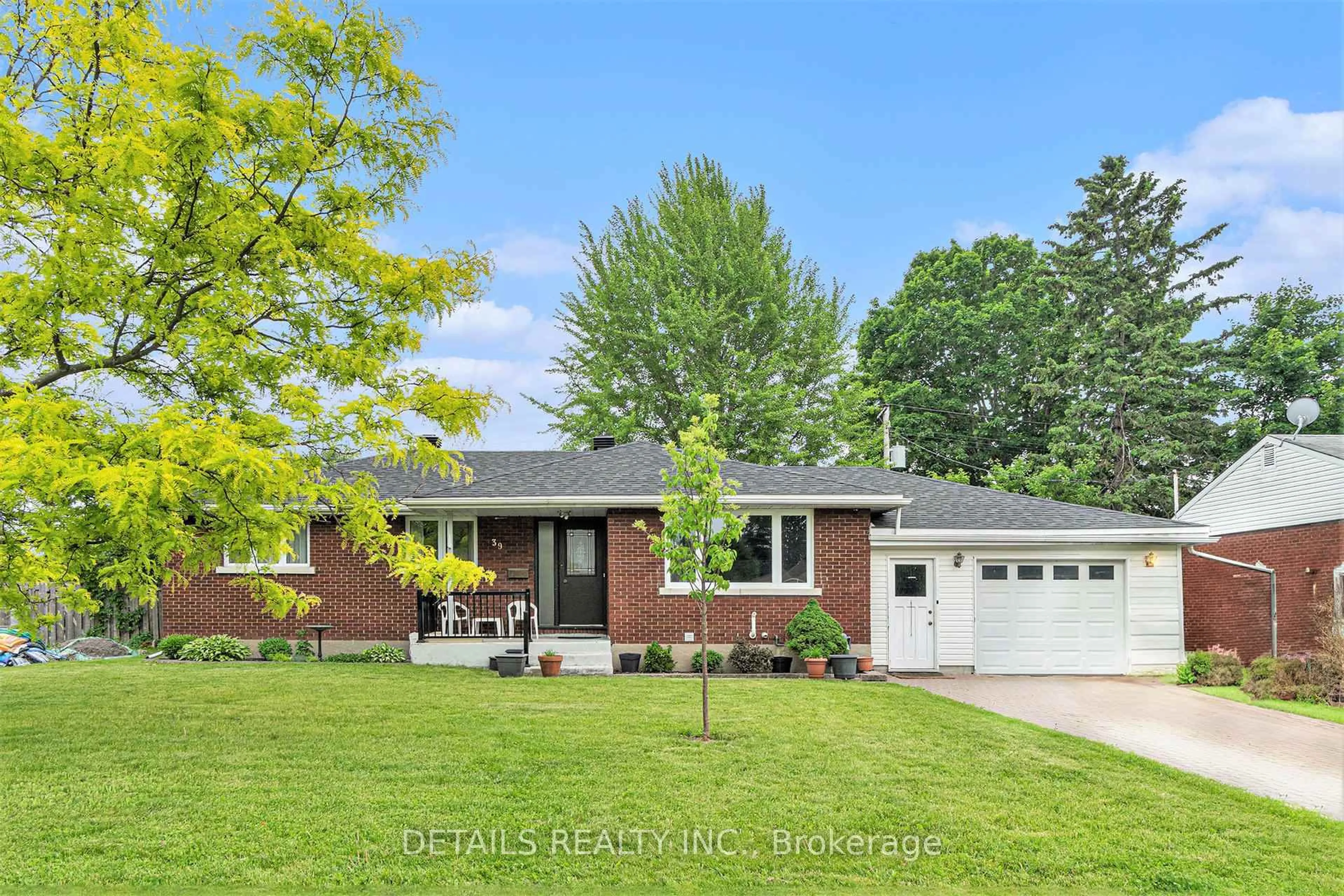 Home with brick exterior material, street for 39 Roundhay Dr, Ottawa Ontario K2G 1B6