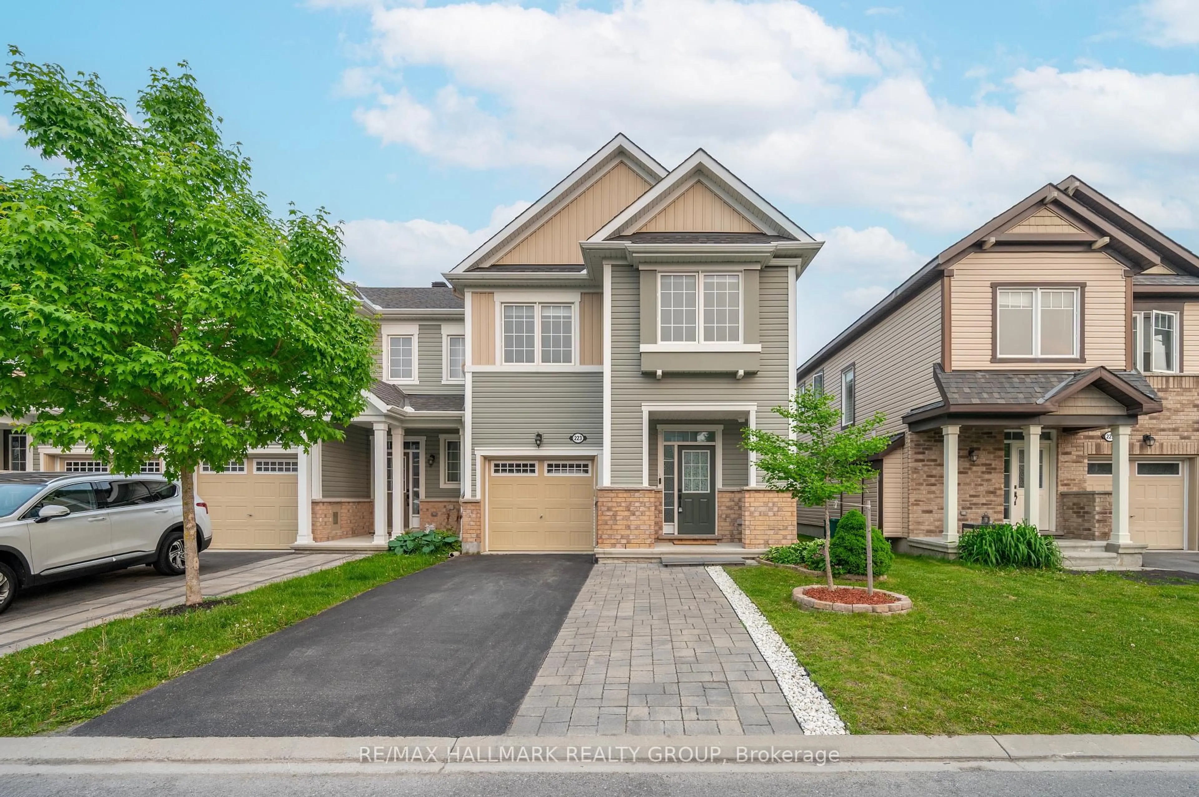 Home with brick exterior material, street for 223 Conifer Creek Circ, Ottawa Ontario K2M 0M2
