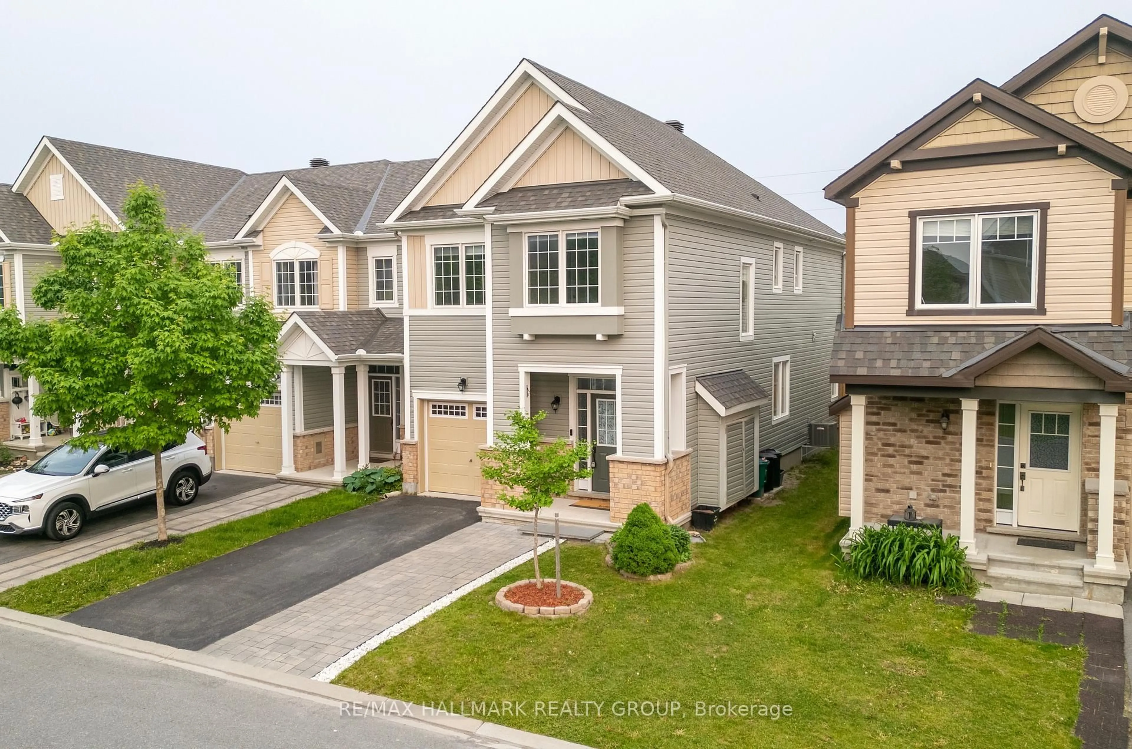 A pic from outside/outdoor area/front of a property/back of a property/a pic from drone, street for 223 Conifer Creek Circ, Ottawa Ontario K2M 0M2