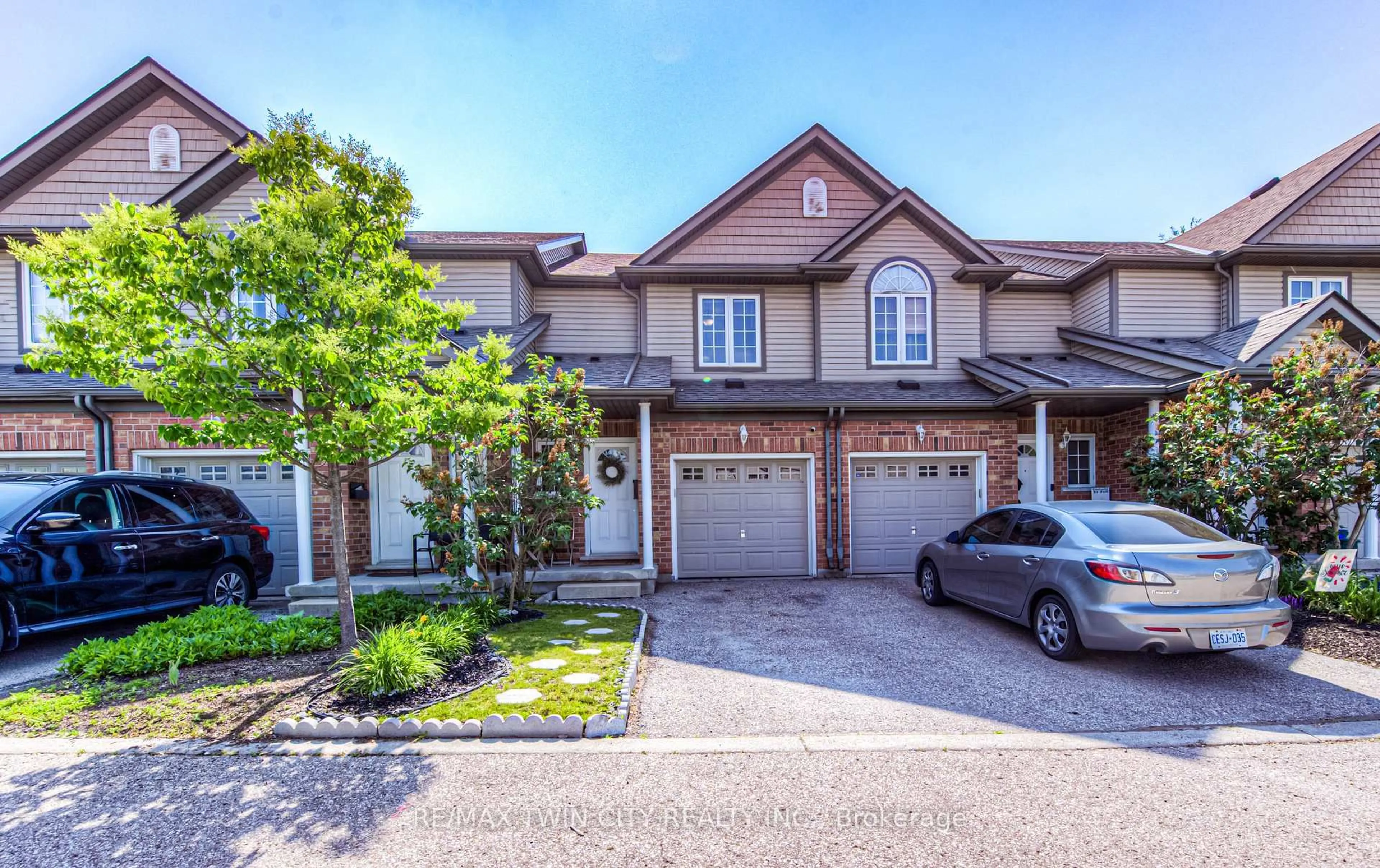 Home with brick exterior material, street for 972 Strasburg Rd #4, Kitchener Ontario N2E 2K4
