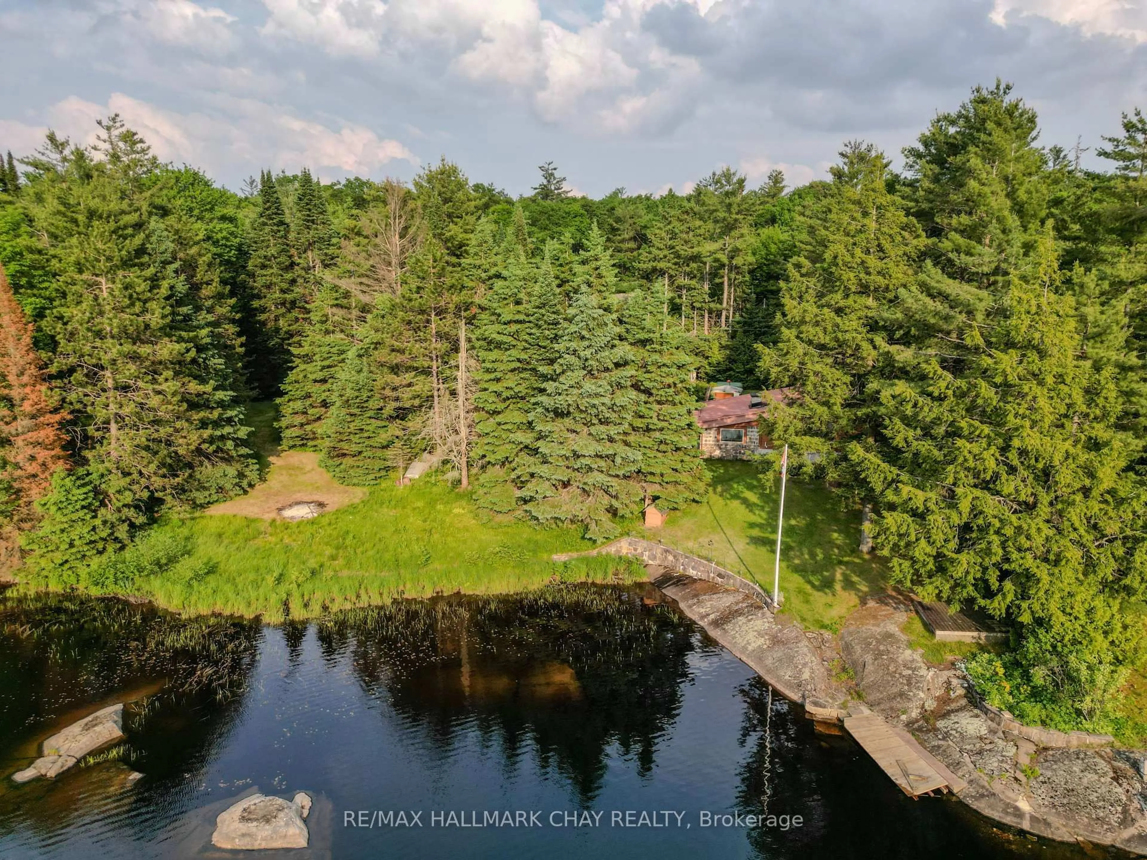 A pic from outside/outdoor area/front of a property/back of a property/a pic from drone, water/lake/river/ocean view for 1070 Chaikof Rd, Bracebridge Ontario P1P 1R3
