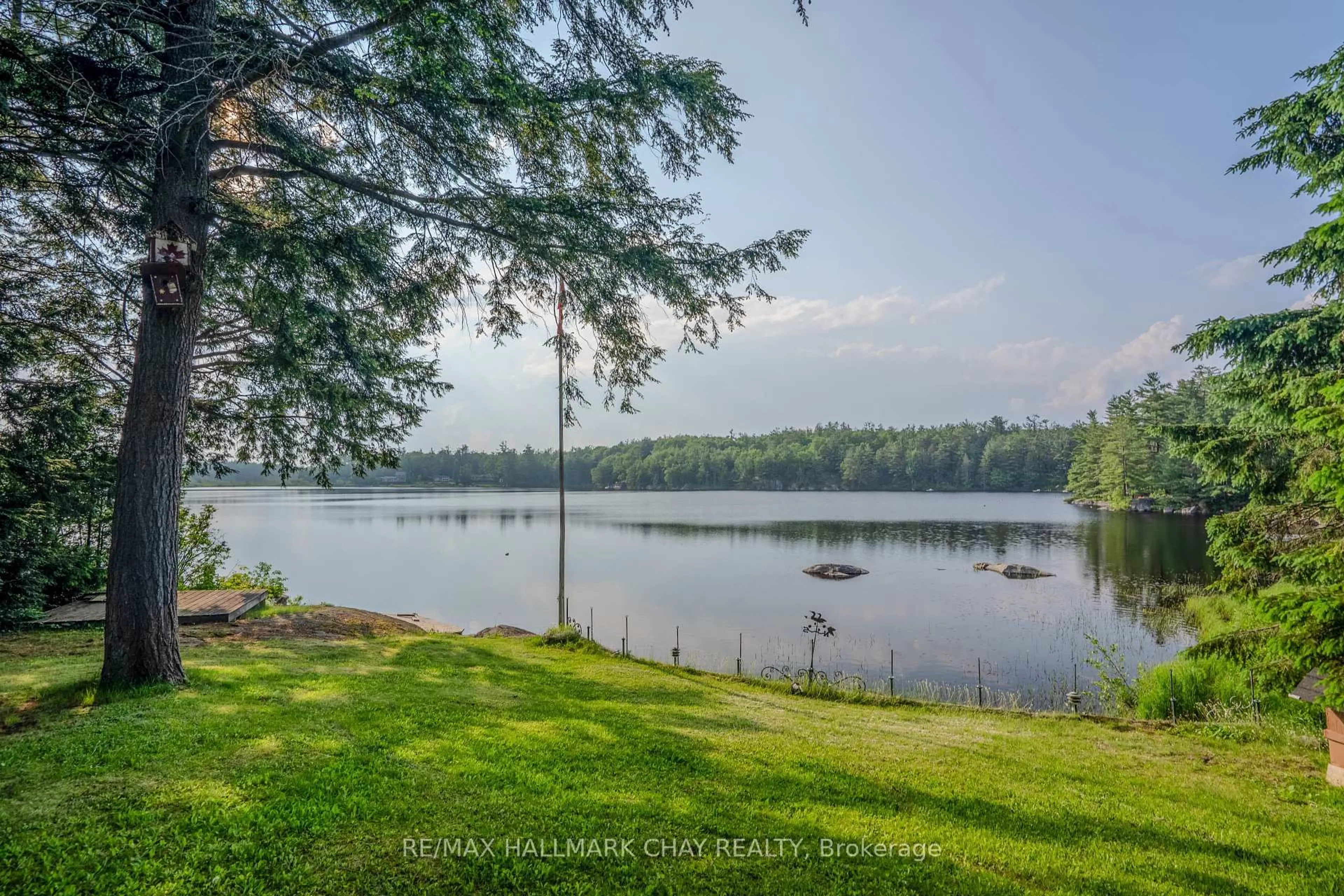 A pic from outside/outdoor area/front of a property/back of a property/a pic from drone, water/lake/river/ocean view for 1070 Chaikof Rd, Bracebridge Ontario P1P 1R3