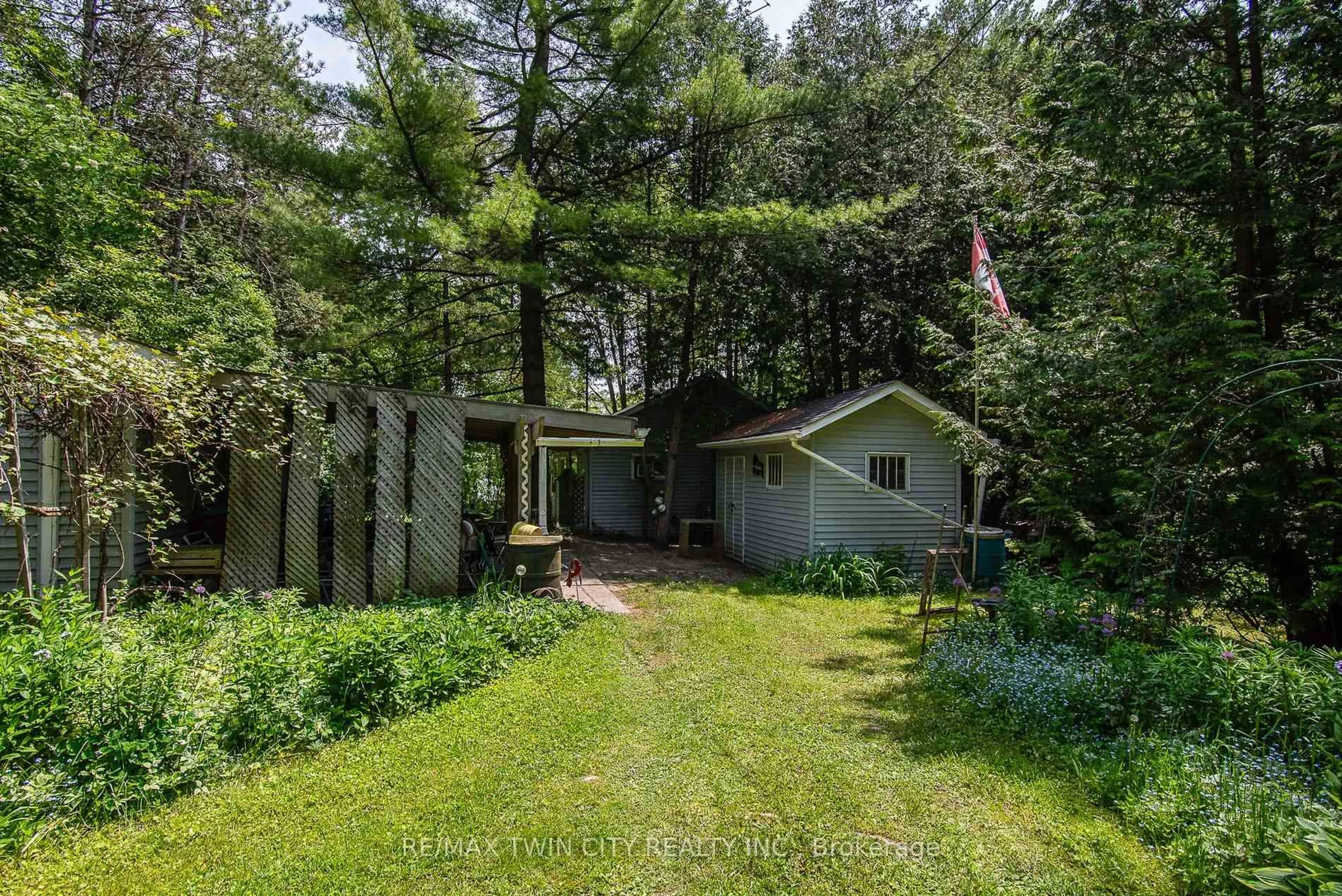 A pic from outside/outdoor area/front of a property/back of a property/a pic from drone, forest/trees view for 1002 Tenth St, Centre Wellington Ontario N0B 1J0