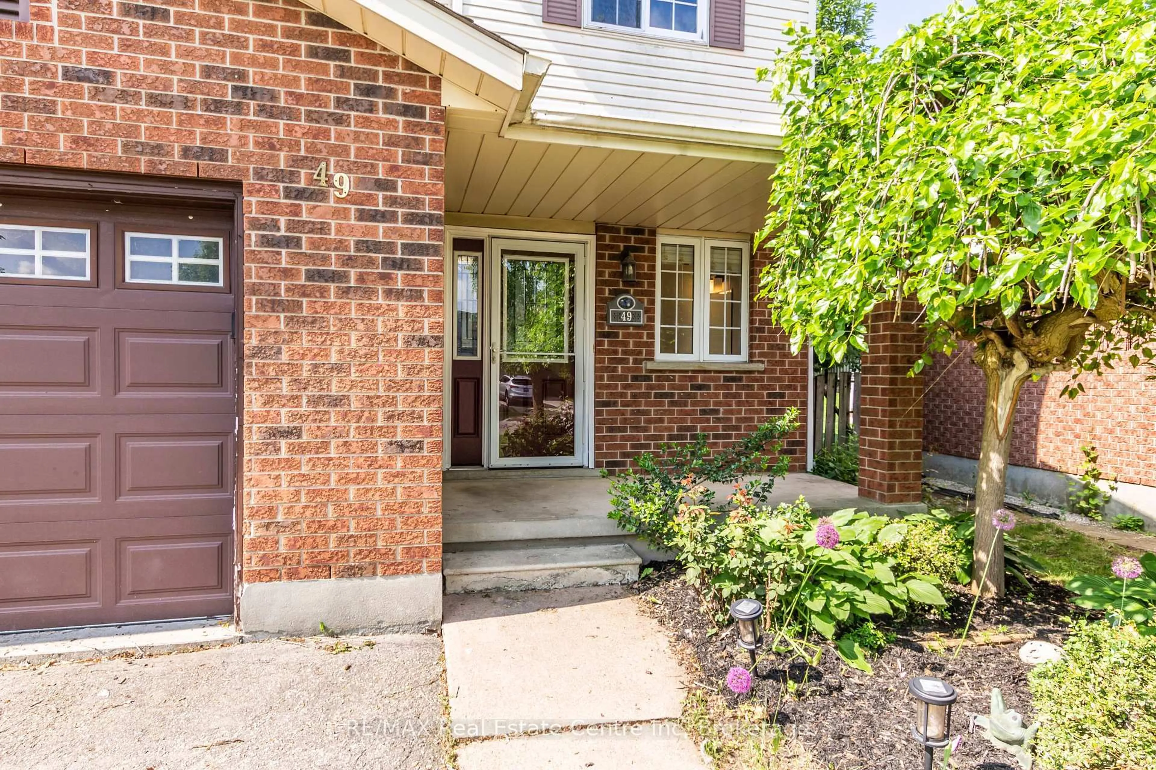 Home with brick exterior material, street for 49 Watt St, Guelph Ontario N1E 6W7