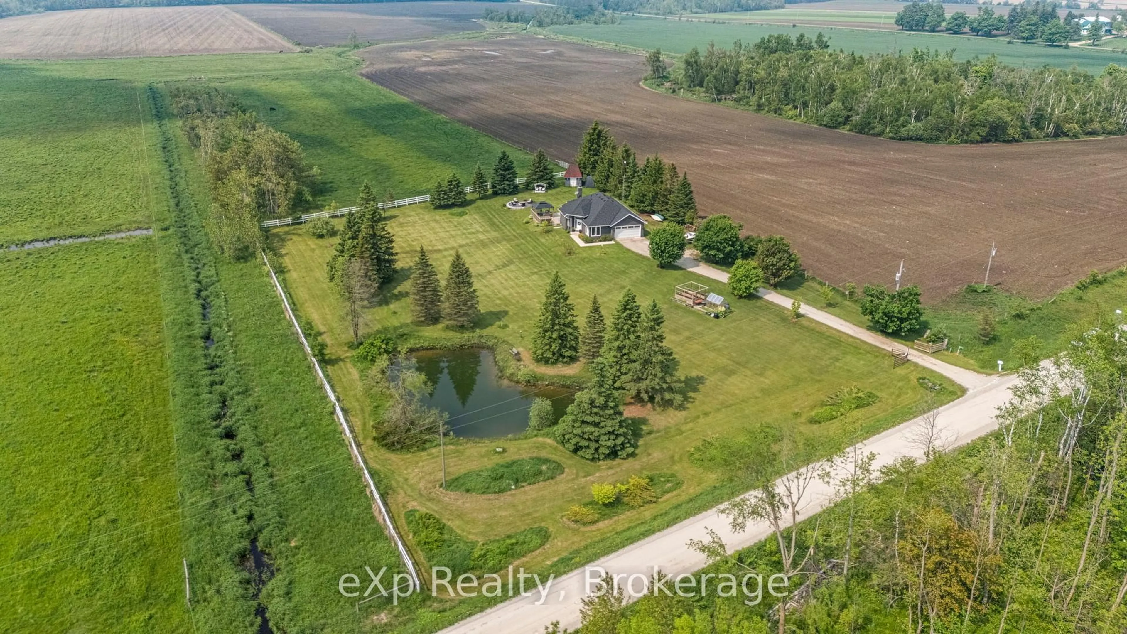 A pic from outside/outdoor area/front of a property/back of a property/a pic from drone, water/lake/river/ocean view for 267171 South Line B, Grey Highlands Ontario N0C 1L0