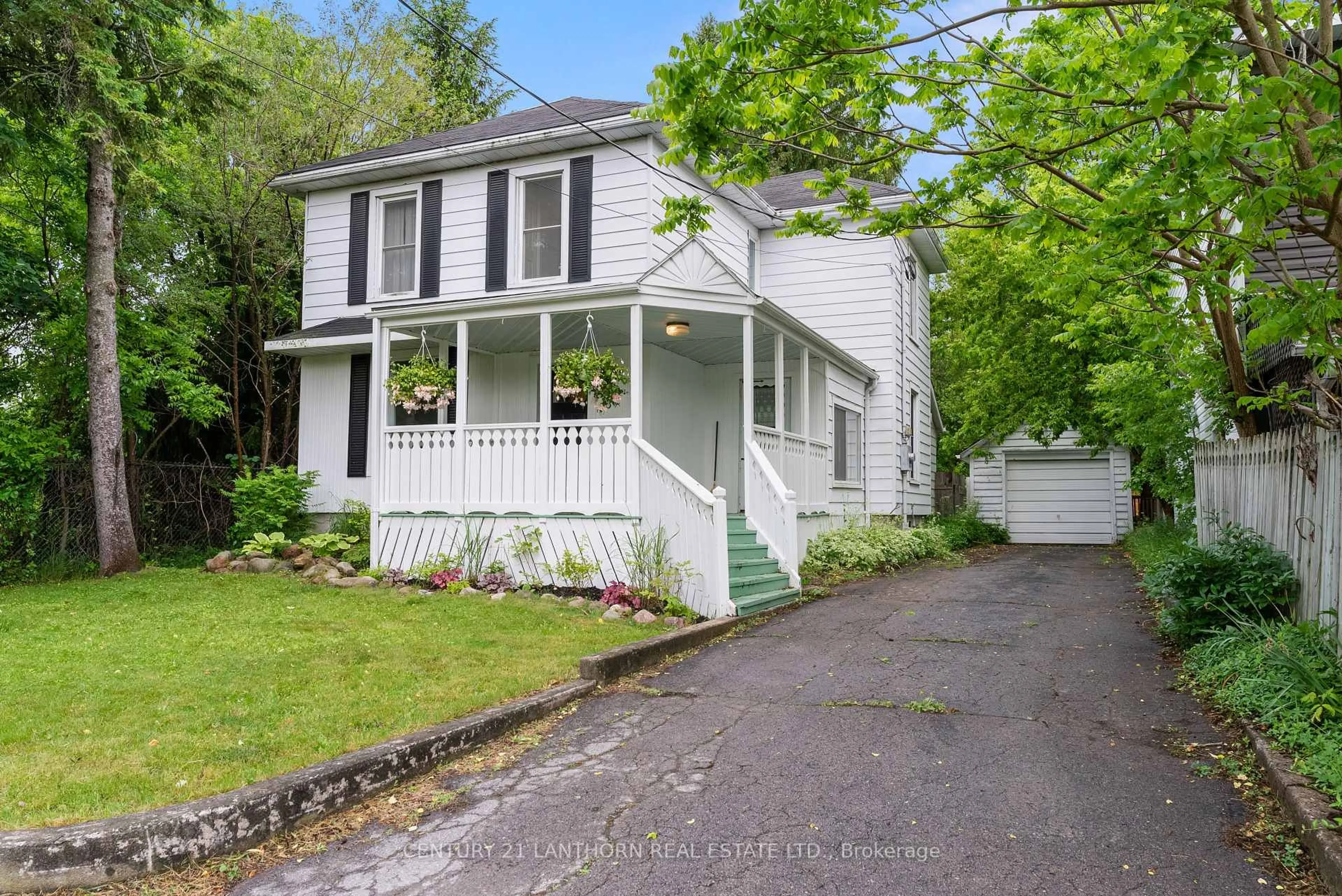 Home with vinyl exterior material, street for 18 Elm St, Prince Edward County Ontario K0K 2T0