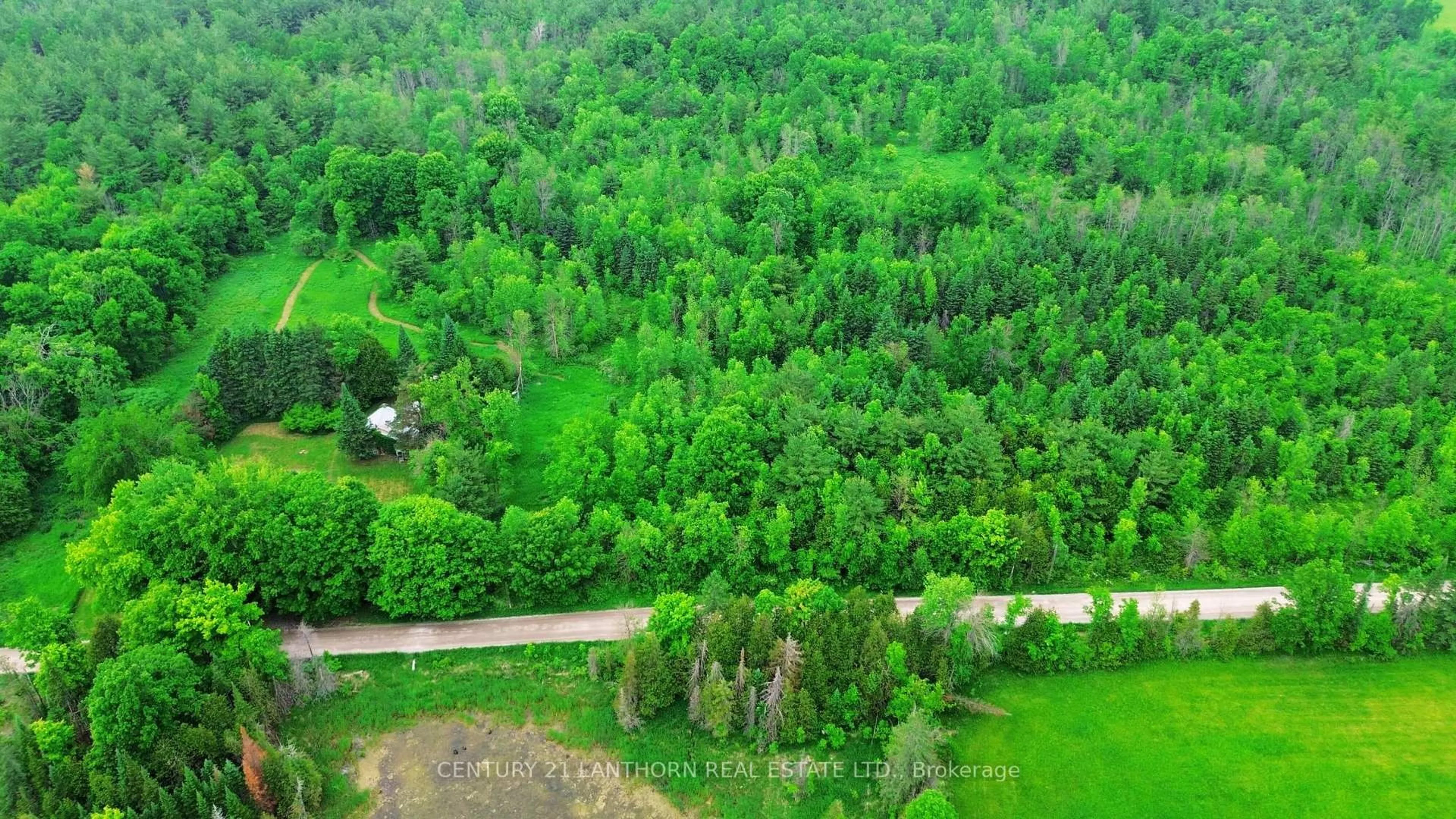 A pic from outside/outdoor area/front of a property/back of a property/a pic from drone, forest/trees view for 118 Storms Rd, Limoges Ontario K0K 2M0