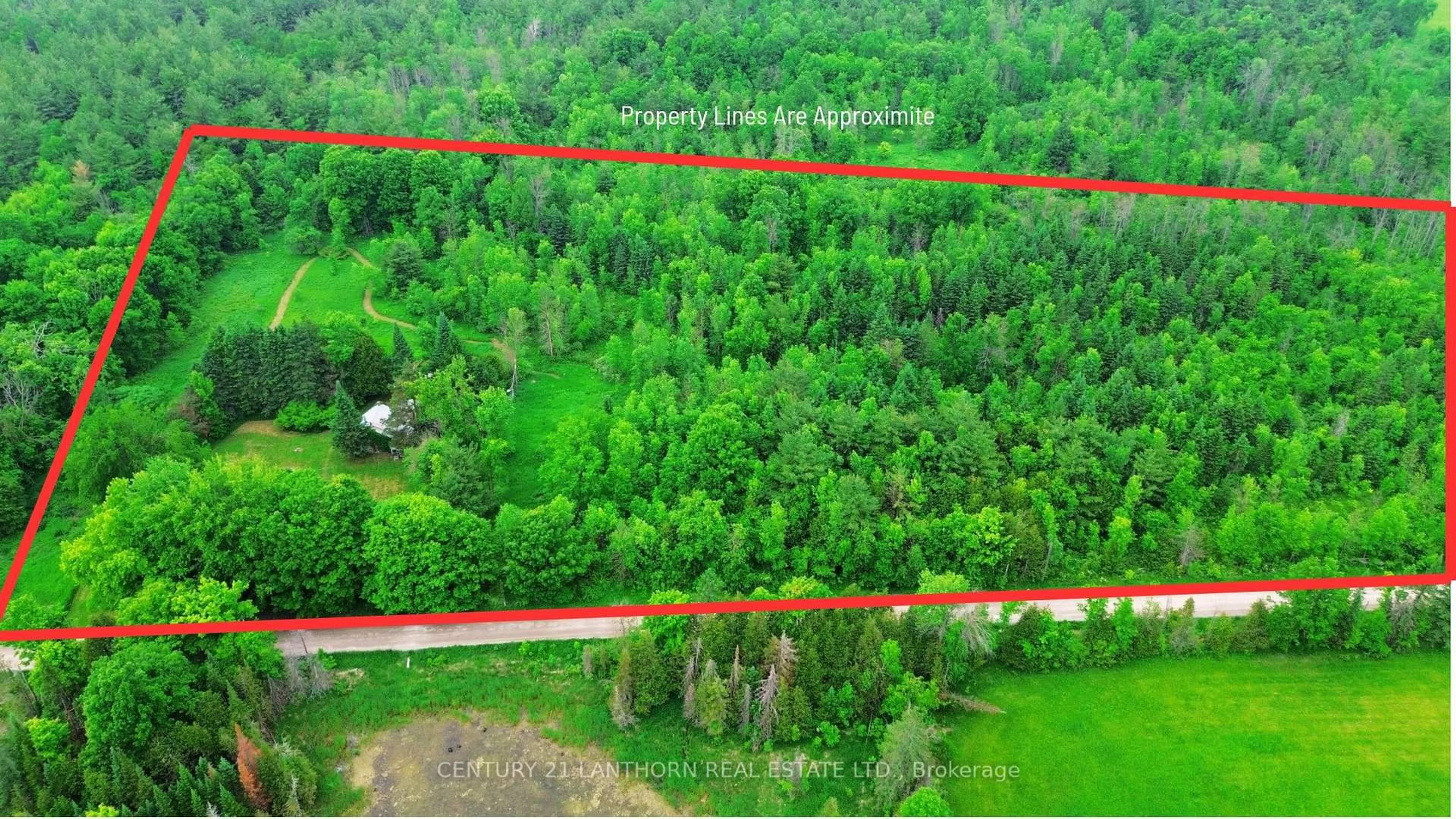A pic from outside/outdoor area/front of a property/back of a property/a pic from drone, forest/trees view for 118 Storms Rd, Limoges Ontario K0K 2M0