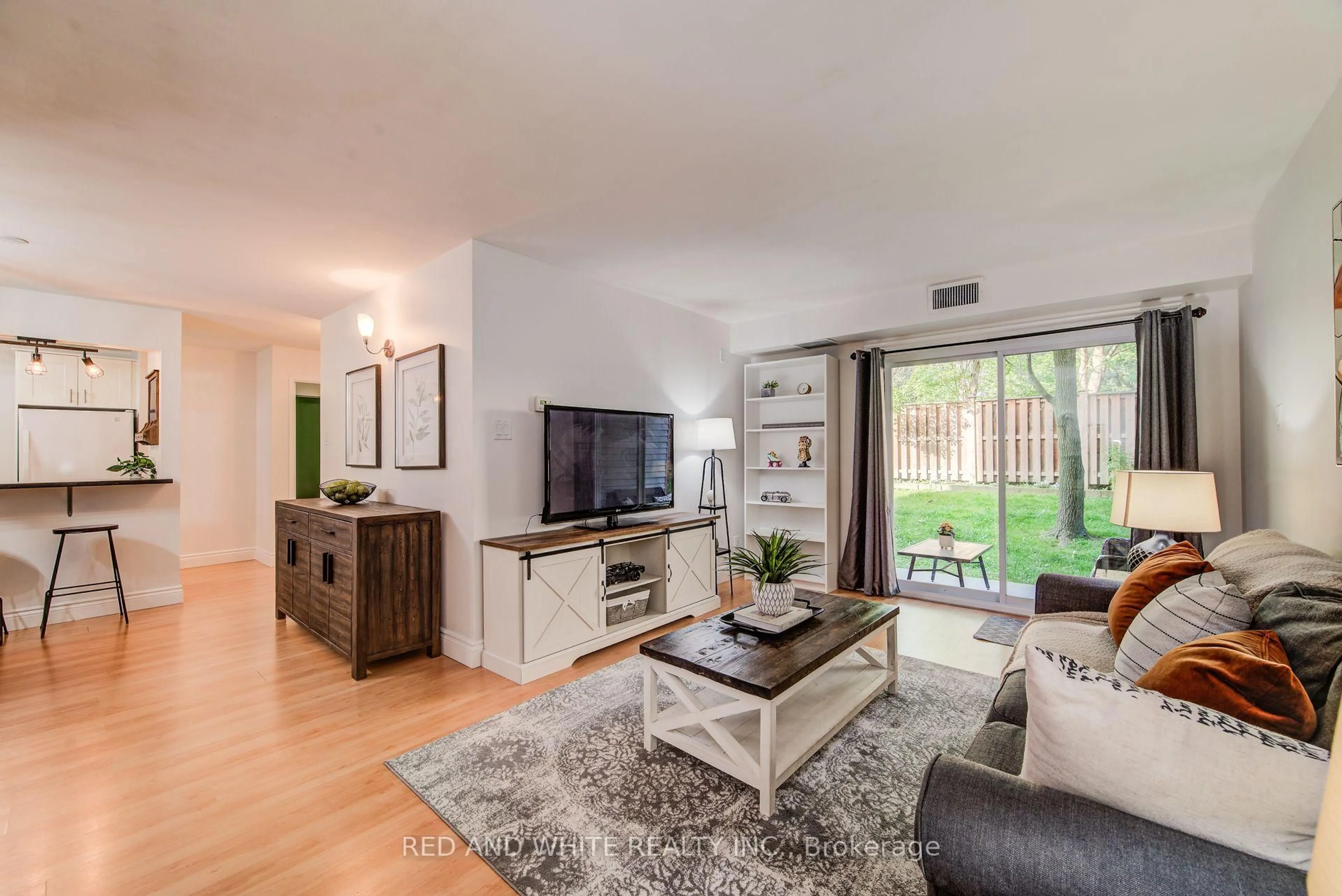 Living room with furniture, wood/laminate floor for 500 Westmount St #205, Kitchener Ontario N2M 5M9