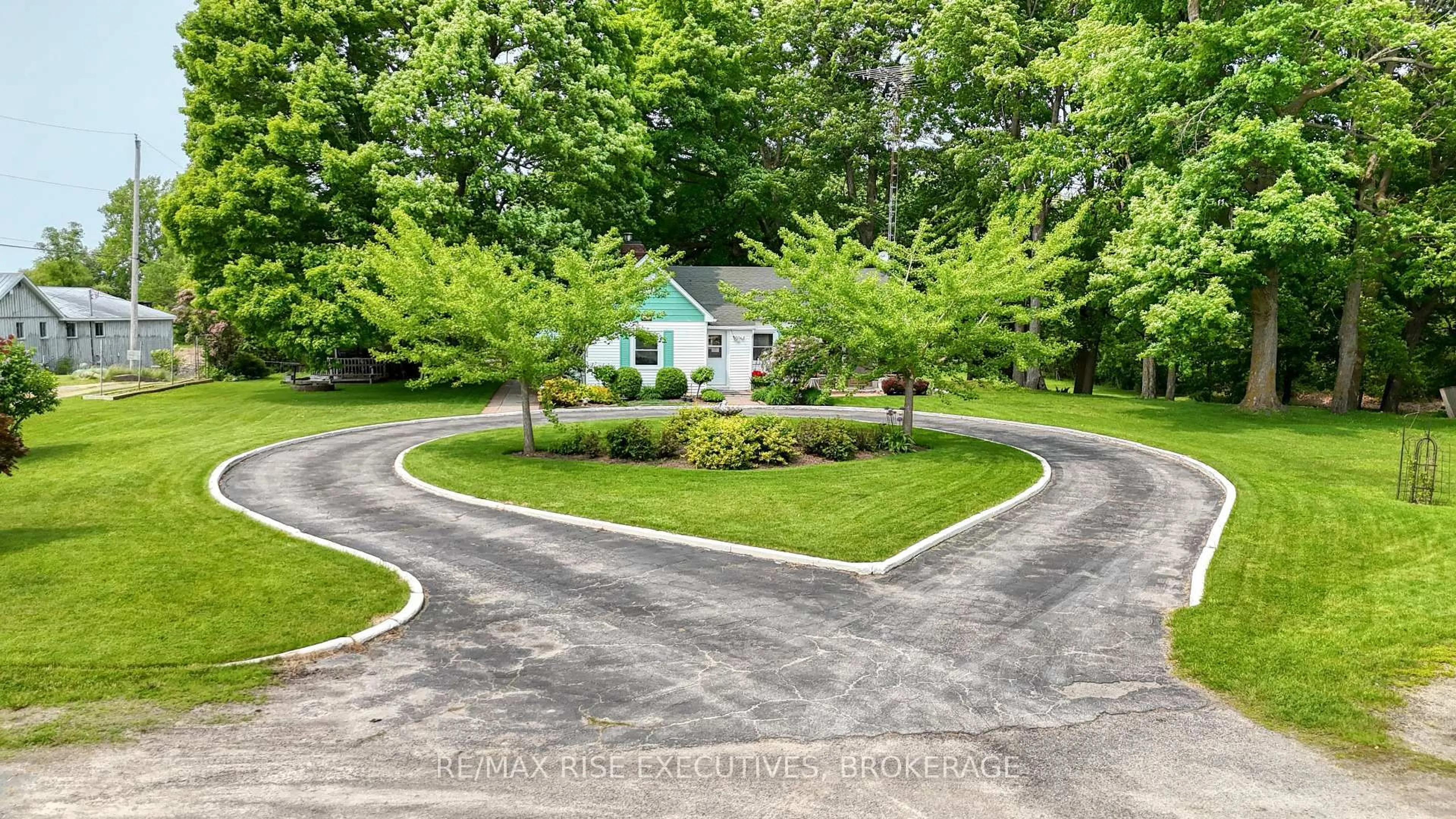 A pic from outside/outdoor area/front of a property/back of a property/a pic from drone, street for 204 Road 33, Rideau Lakes Ontario K0G 1V0