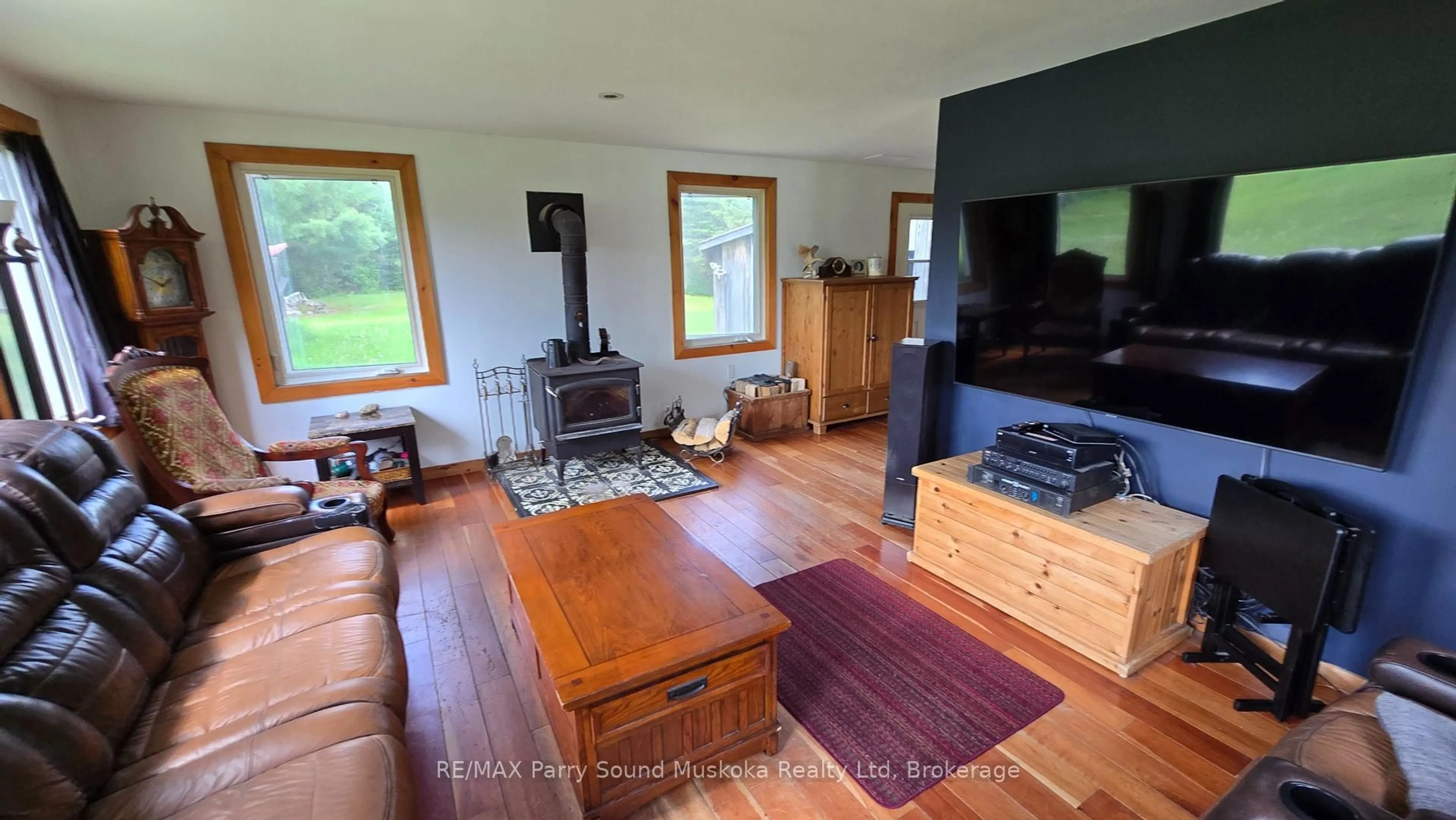 Living room with furniture, wood/laminate floor for 308 King Lake Rd, Machar Ontario P0A 1X0