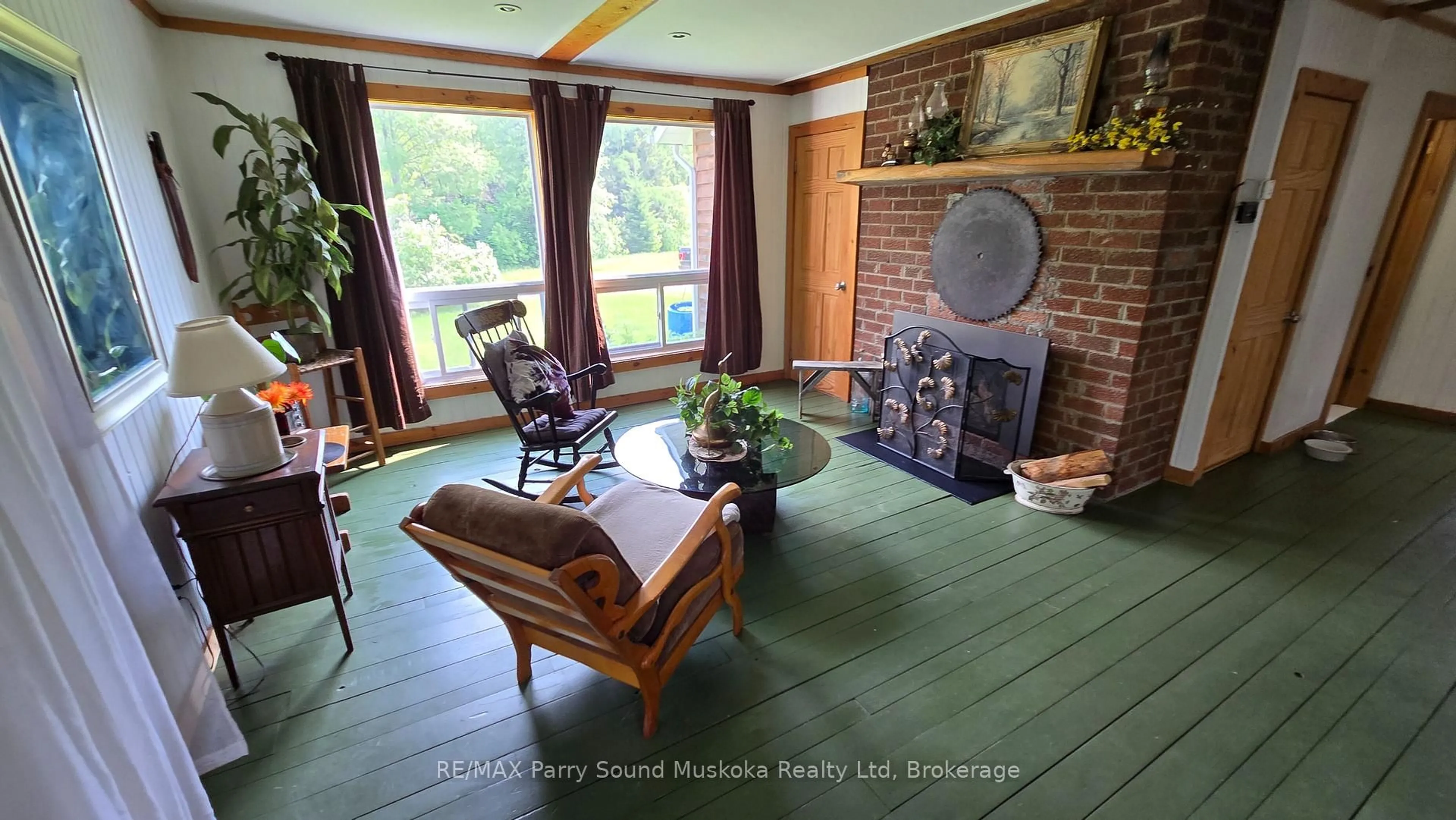 Living room with furniture, wood/laminate floor for 308 King Lake Rd, Machar Ontario P0A 1X0