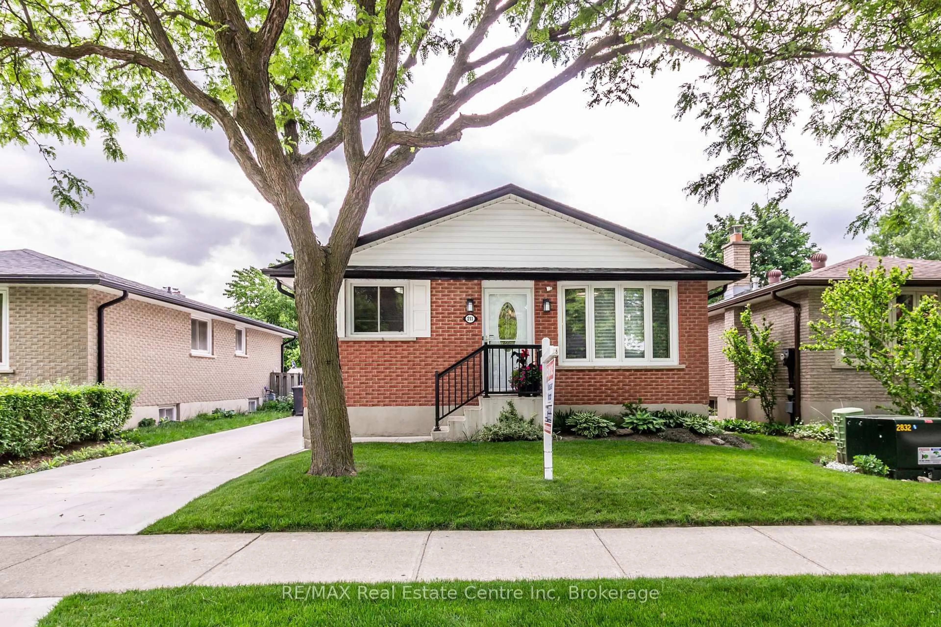 Home with brick exterior material, street for 211 Hadati Rd, Guelph Ontario N1E 6N4