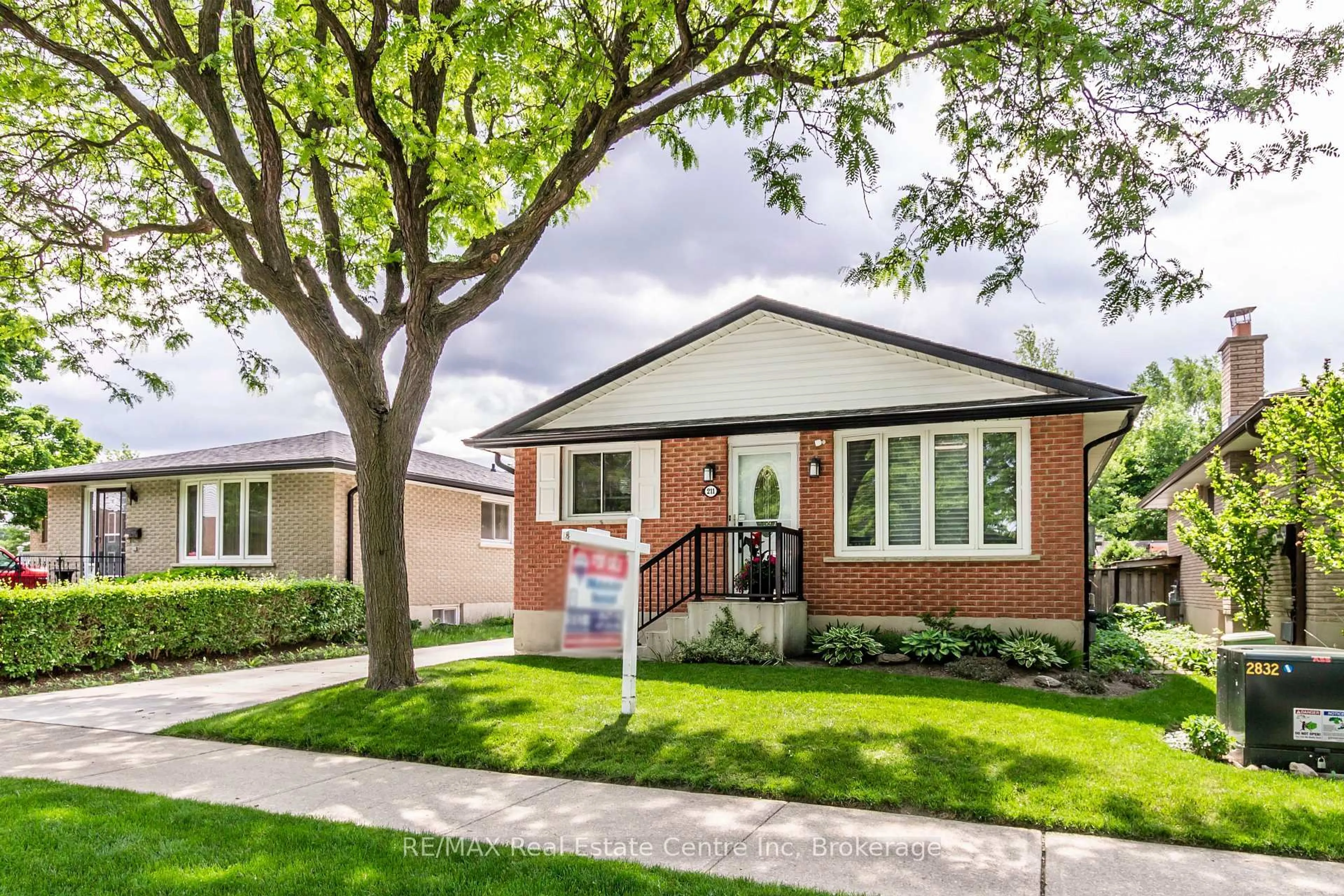 Home with brick exterior material, street for 211 Hadati Rd, Guelph Ontario N1E 6N4