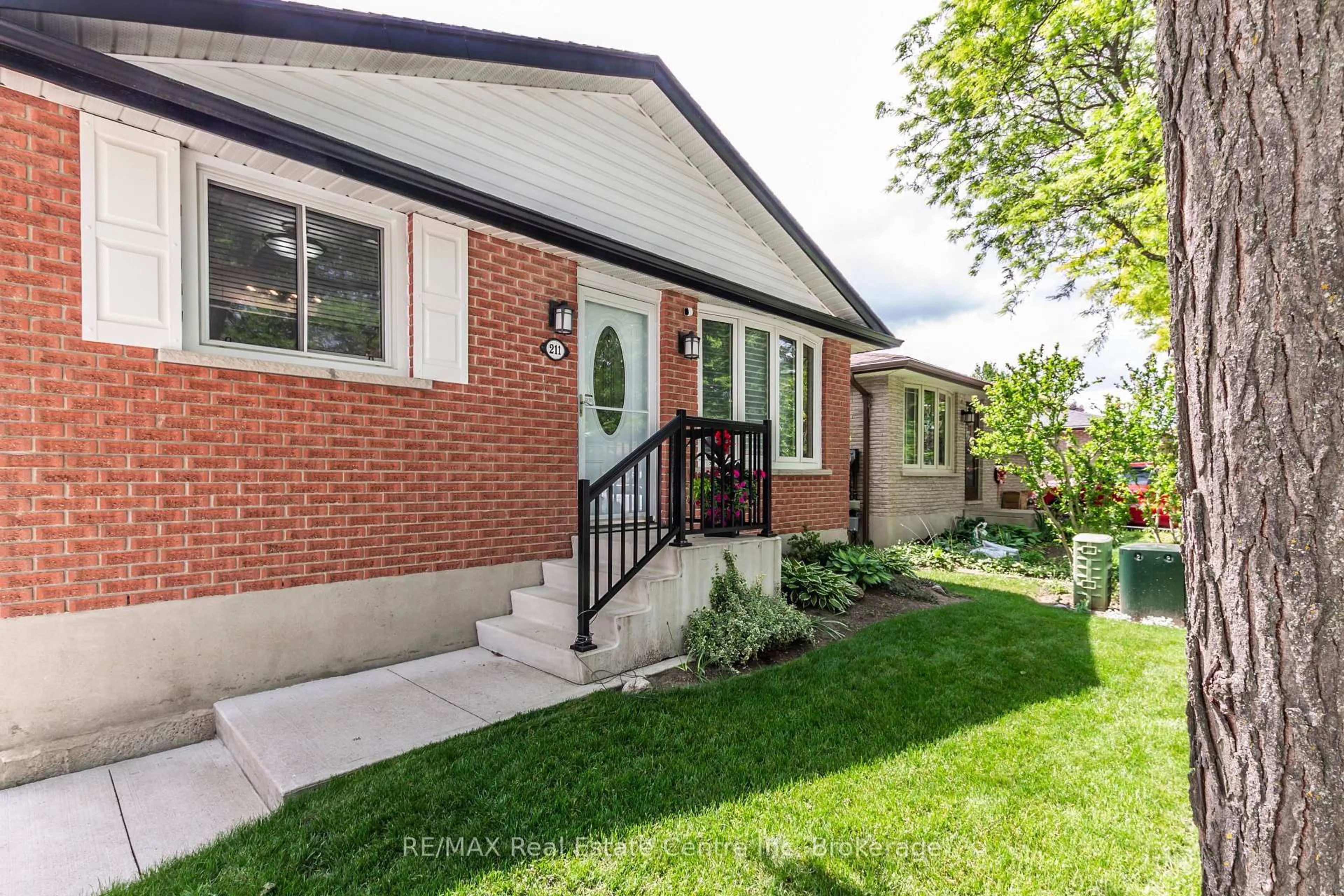 Home with brick exterior material, street for 211 Hadati Rd, Guelph Ontario N1E 6N4