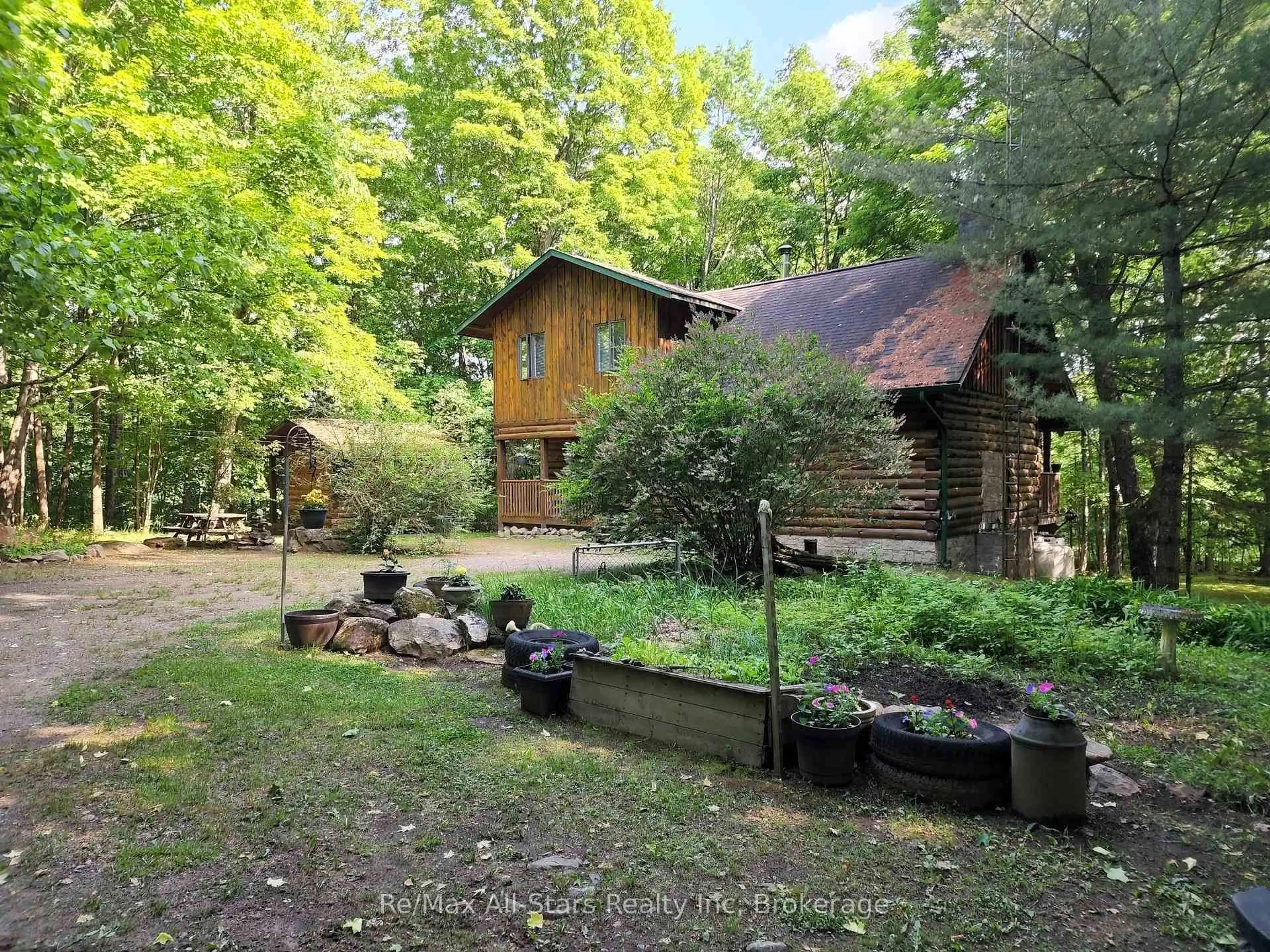 A pic from outside/outdoor area/front of a property/back of a property/a pic from drone, forest/trees view for 1386 South Portage Rd, Lake of Bays Ontario P1H 2J6