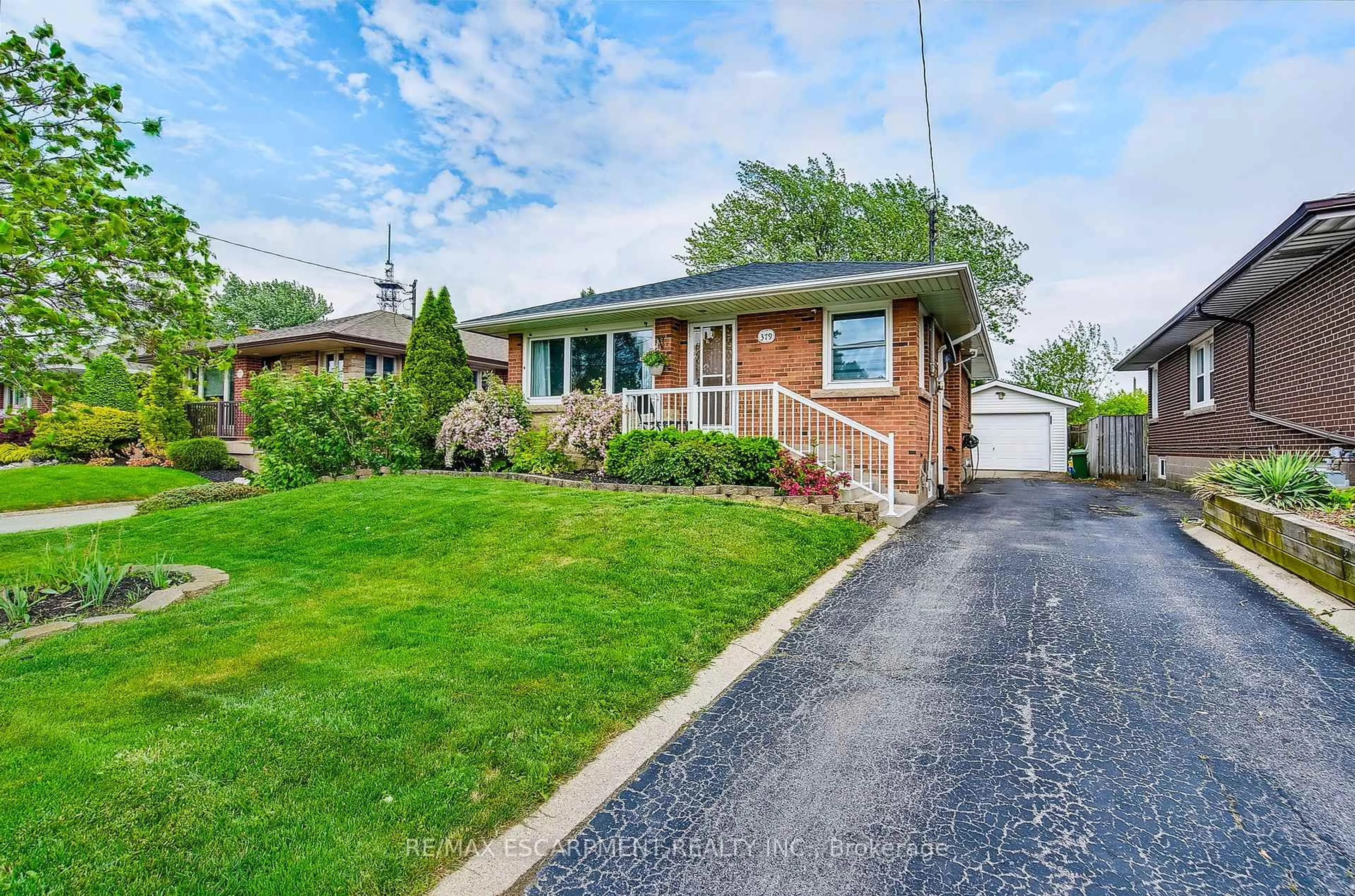 Home with brick exterior material, street for 379 East 18th St, Hamilton Ontario L9A 4P7
