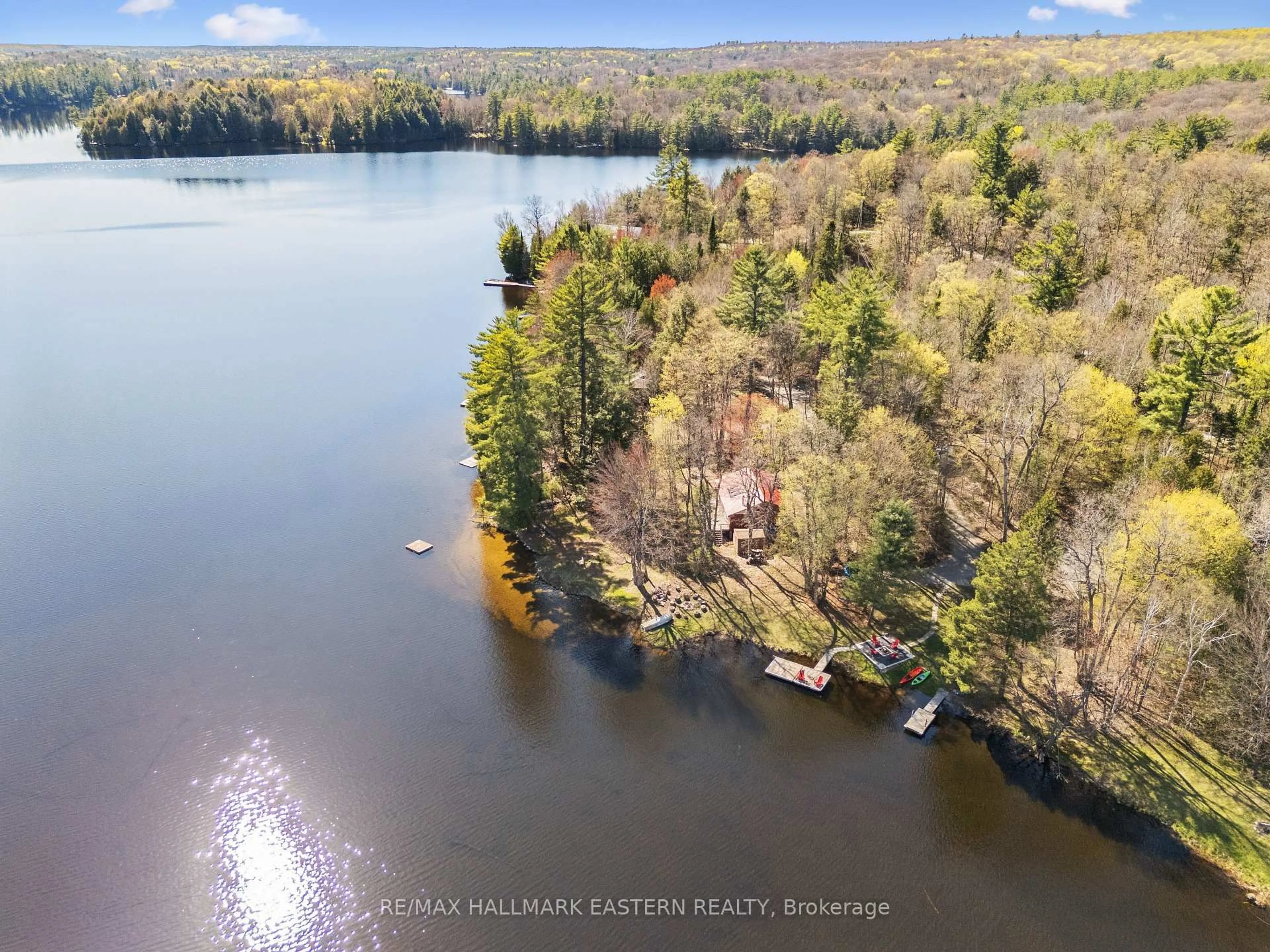 A pic from outside/outdoor area/front of a property/back of a property/a pic from drone, water/lake/river/ocean view for 1025 Dickies Lane, Highlands East Ontario K0M 1R0