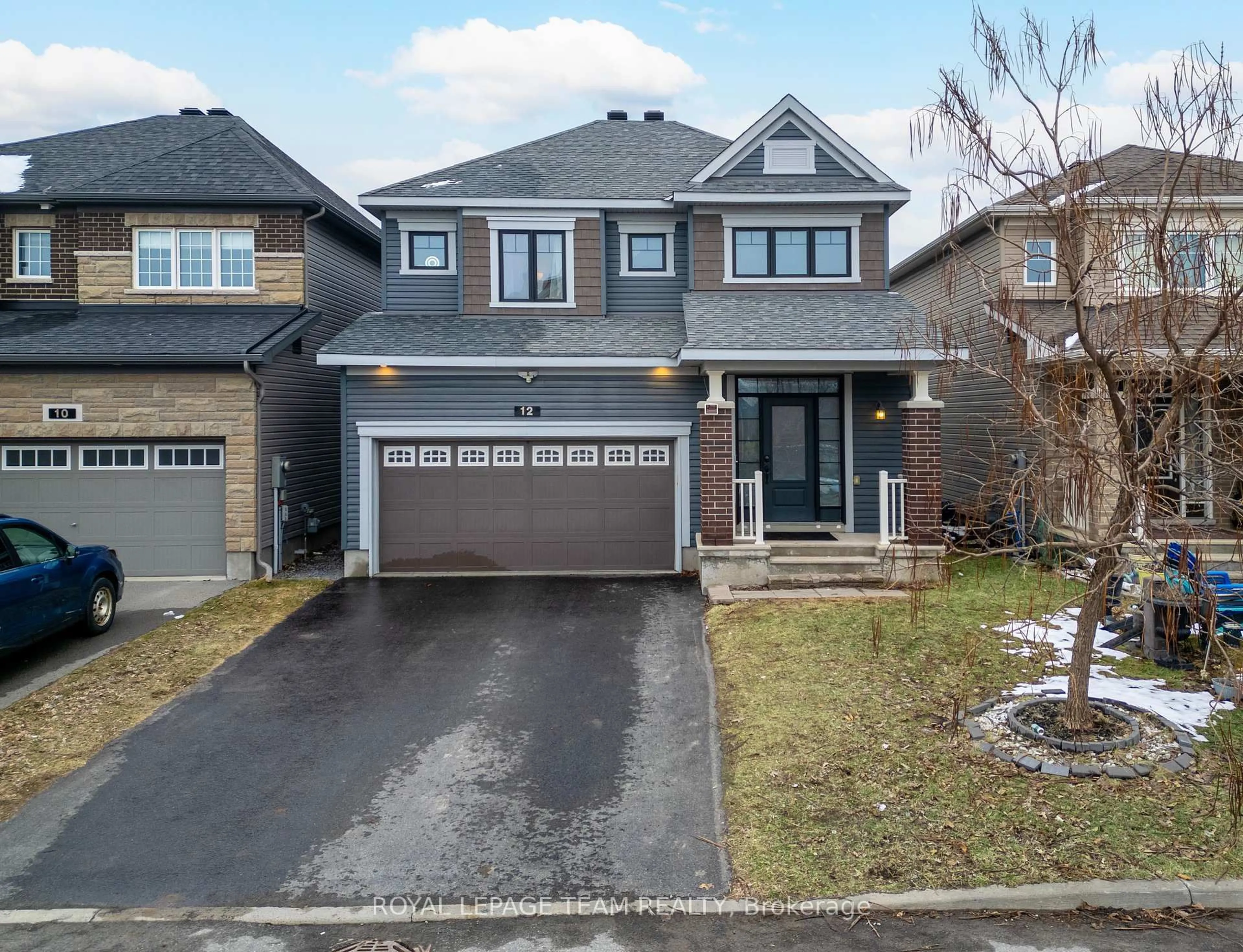 Home with brick exterior material, street for 12 Knockaderry Cres, Ottawa Ontario K2C 3H2