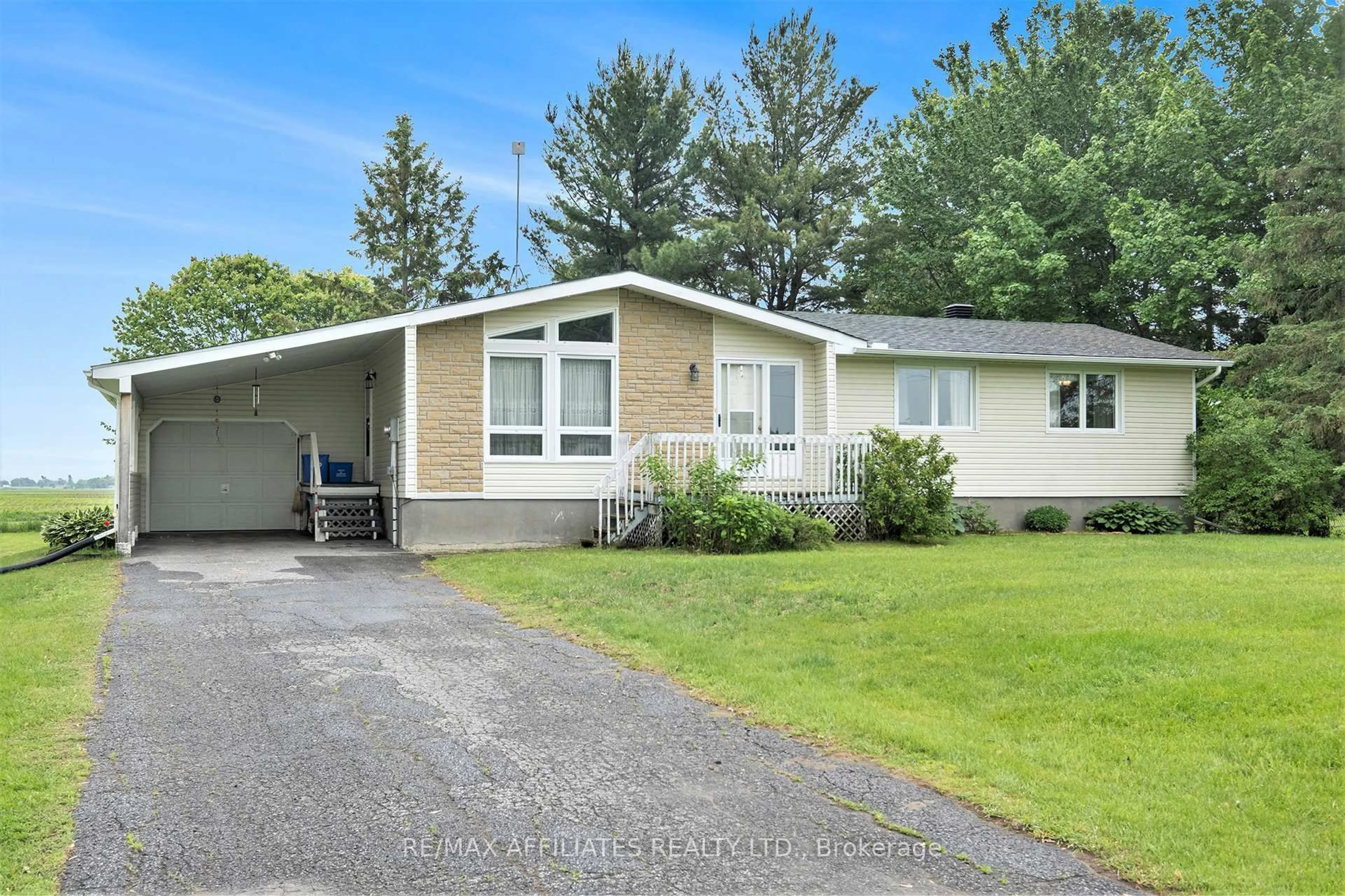 Home with vinyl exterior material, street for 61 Route 500 East, The Nation Ontario K0A 1M0
