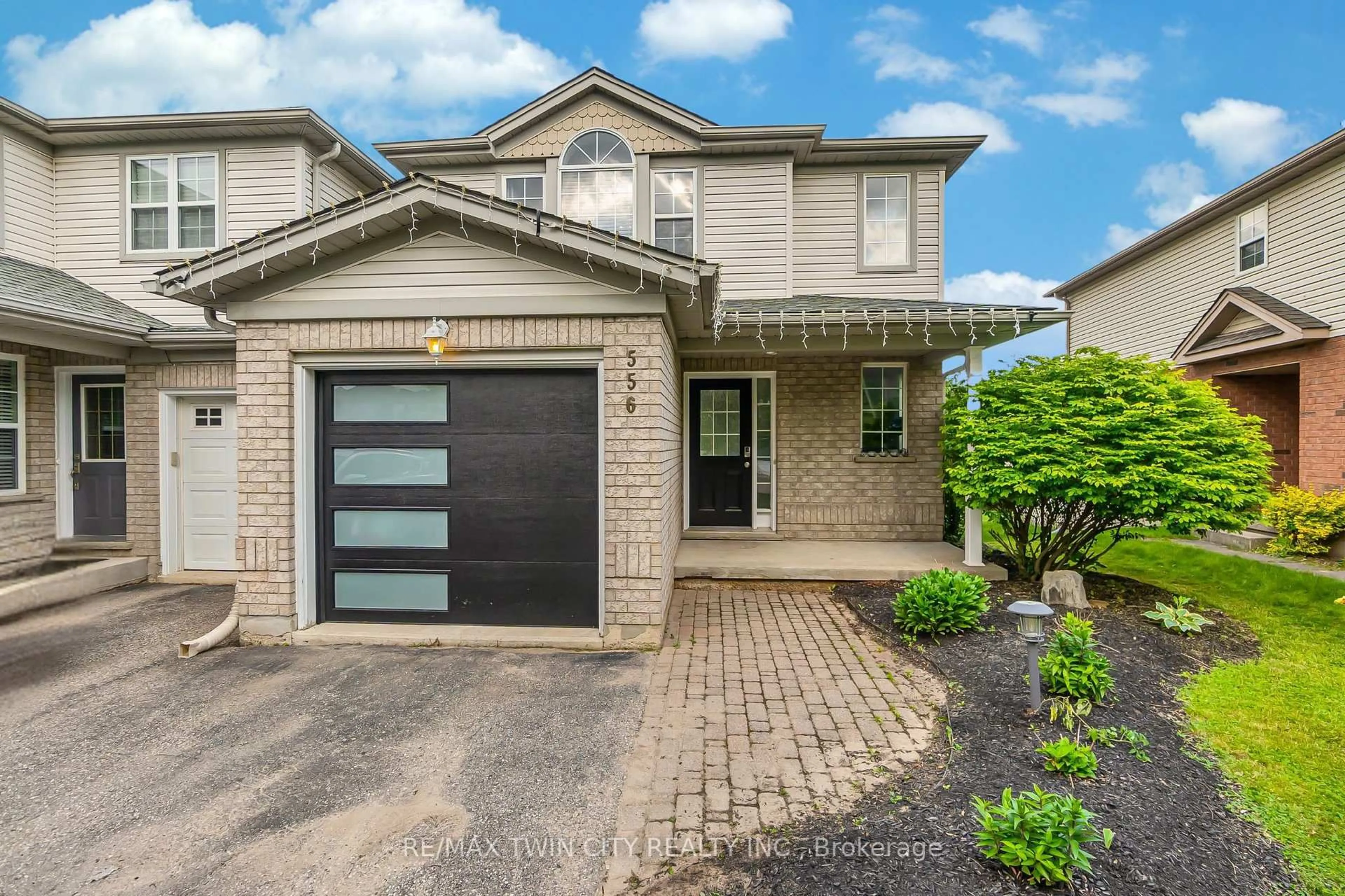 Home with brick exterior material, street for 556 Dansbury Dr, Waterloo Ontario N2K 4E2