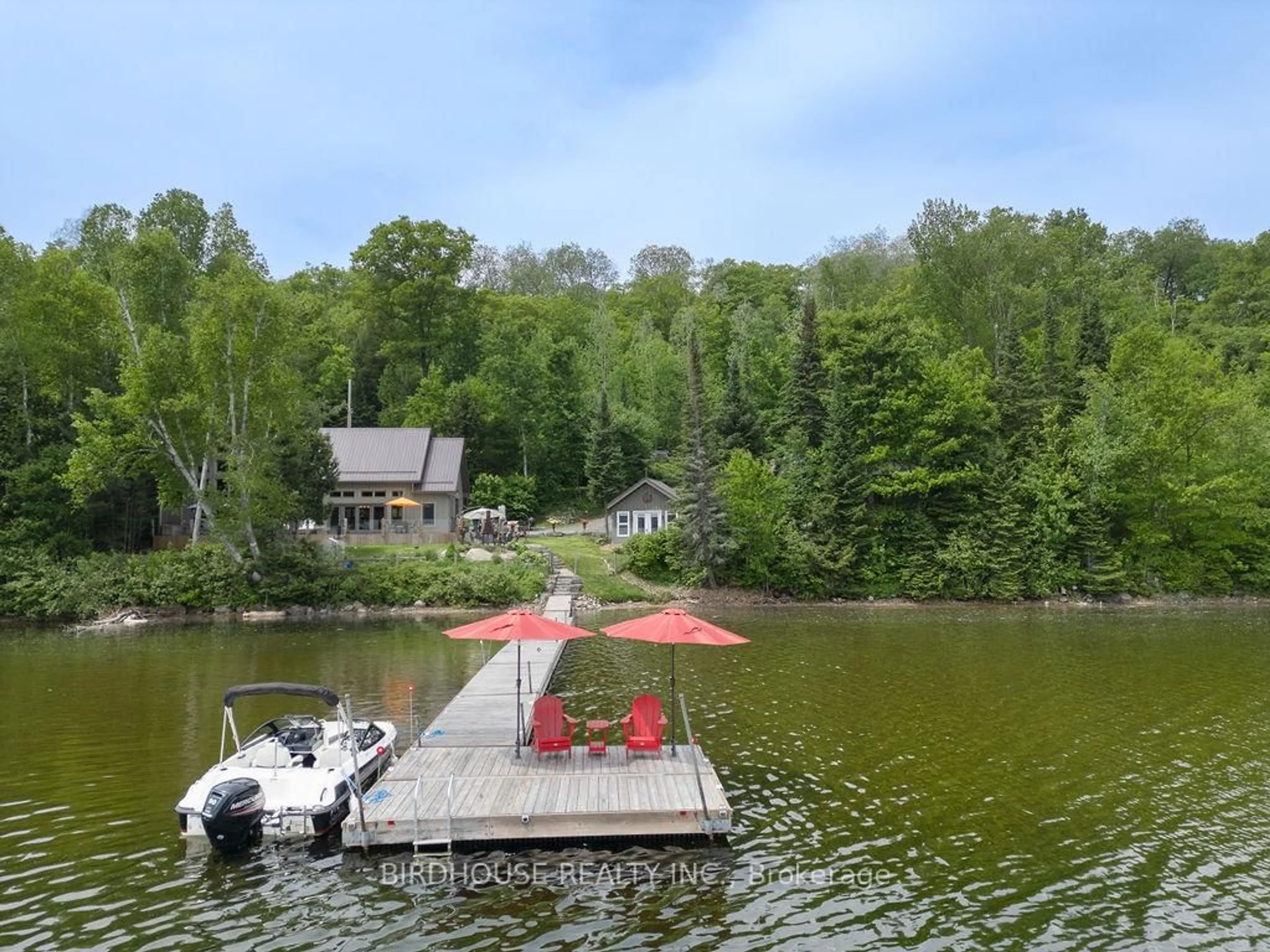 A pic from outside/outdoor area/front of a property/back of a property/a pic from drone, water/lake/river/ocean view for 1172A Papineau Lake Rd, Maple Leaf Ontario K0L 2R0