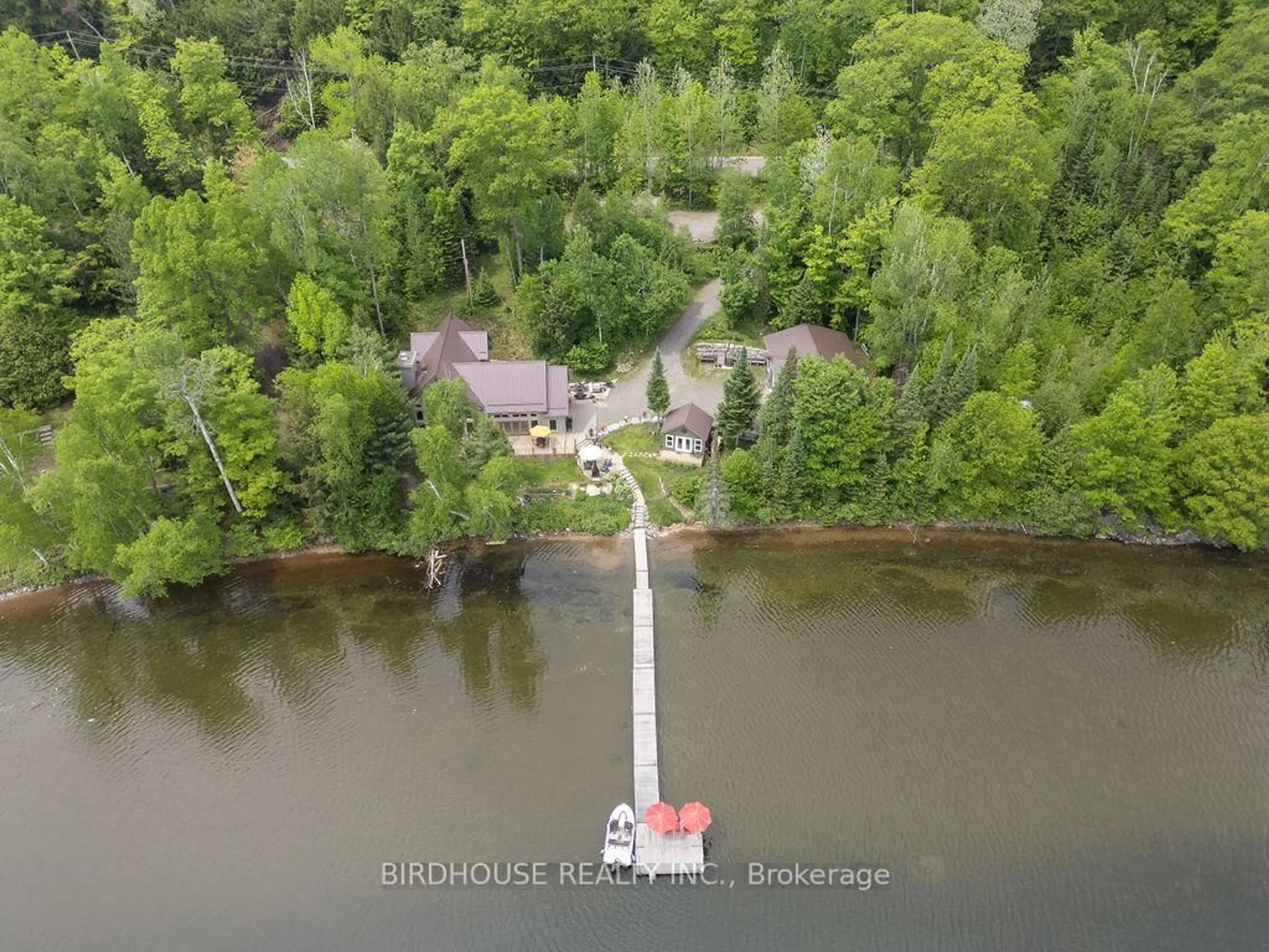 A pic from outside/outdoor area/front of a property/back of a property/a pic from drone, water/lake/river/ocean view for 1172A Papineau Lake Rd, Maple Leaf Ontario K0L 2R0