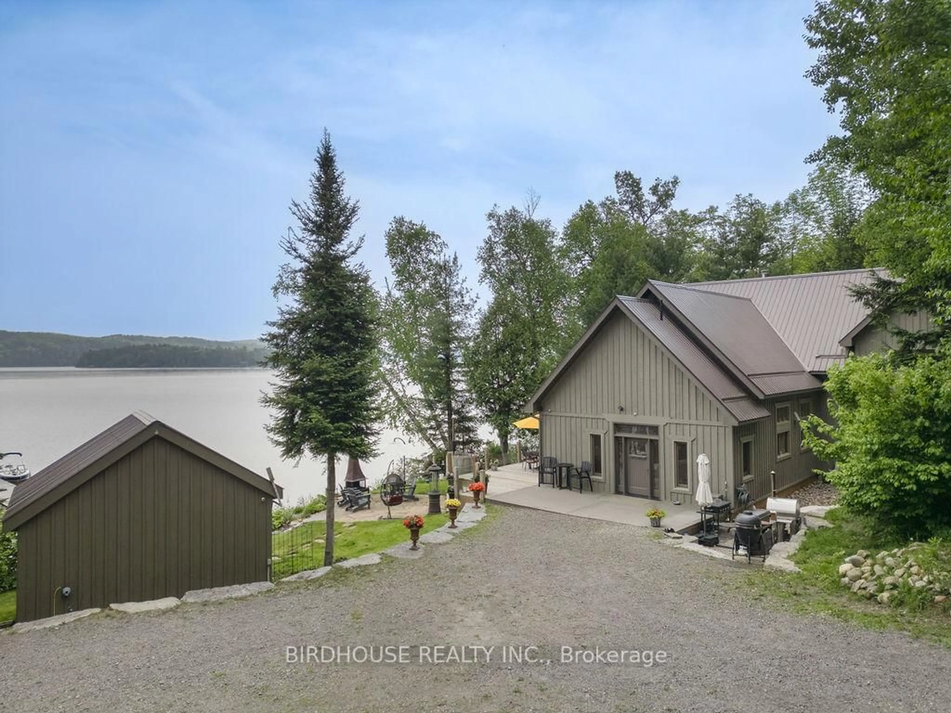 A pic from outside/outdoor area/front of a property/back of a property/a pic from drone, water/lake/river/ocean view for 1172A Papineau Lake Rd, Maple Leaf Ontario K0L 2R0