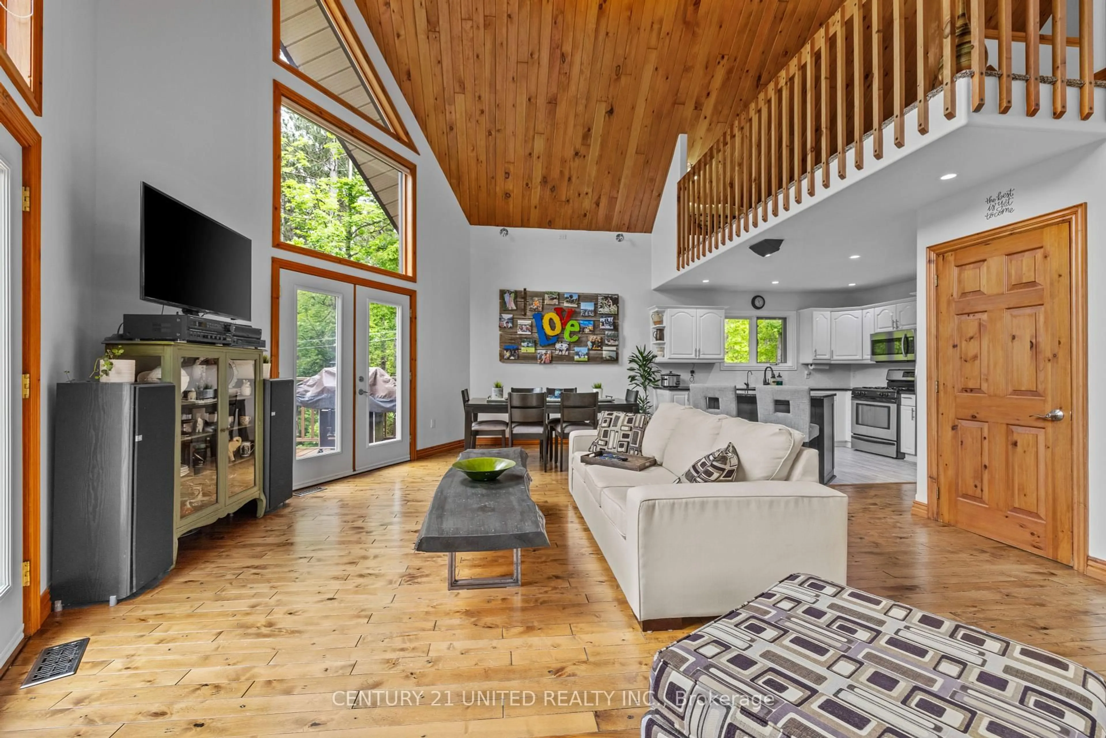 Living room with furniture, wood/laminate floor for 113 Sugarbush Blvd, Trent Lakes Ontario K0L 1J0