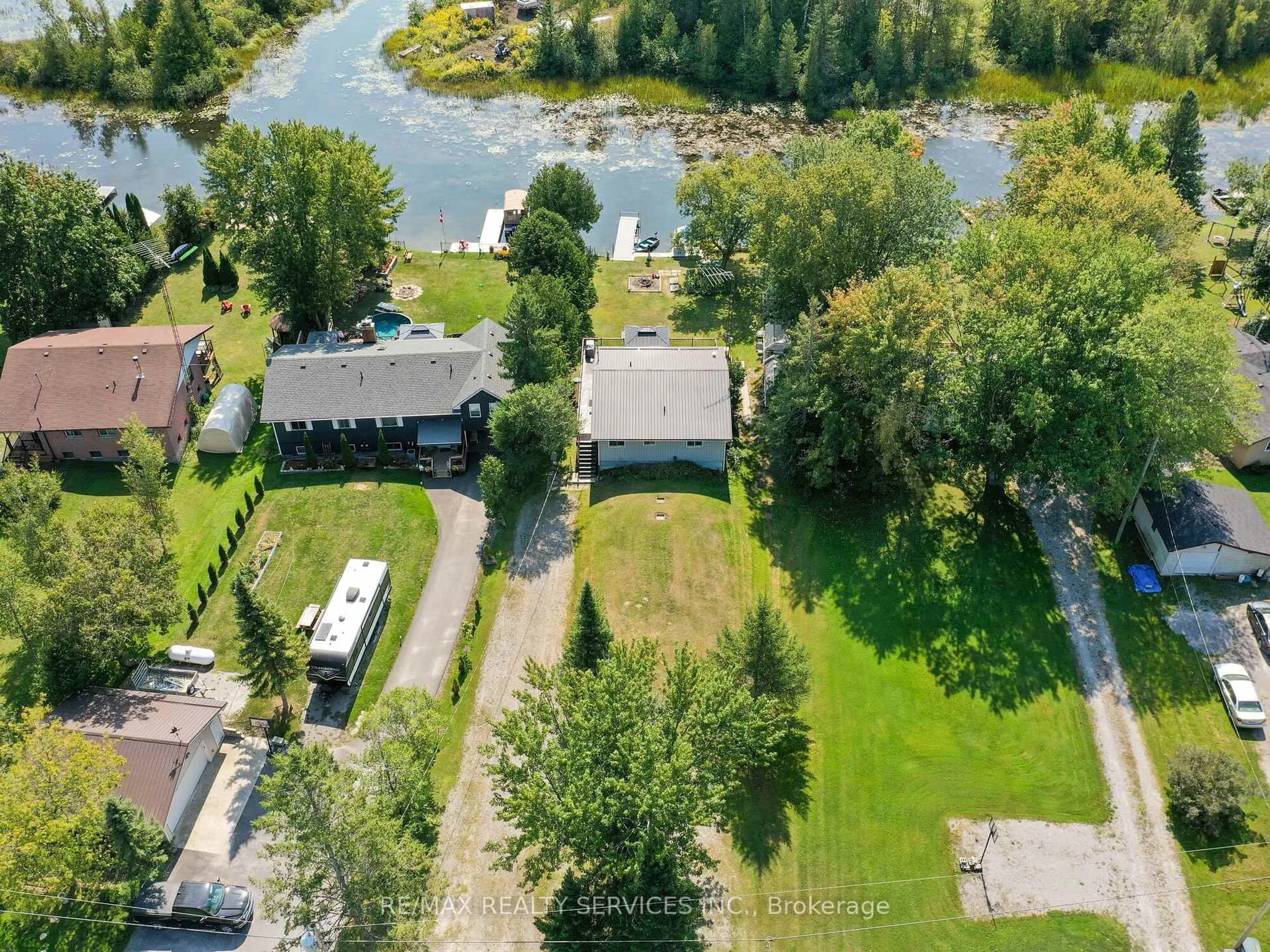 A pic from outside/outdoor area/front of a property/back of a property/a pic from drone, water/lake/river/ocean view for 183 Mcguire Beach Rd, Kawartha Lakes Ontario K0M 2B0