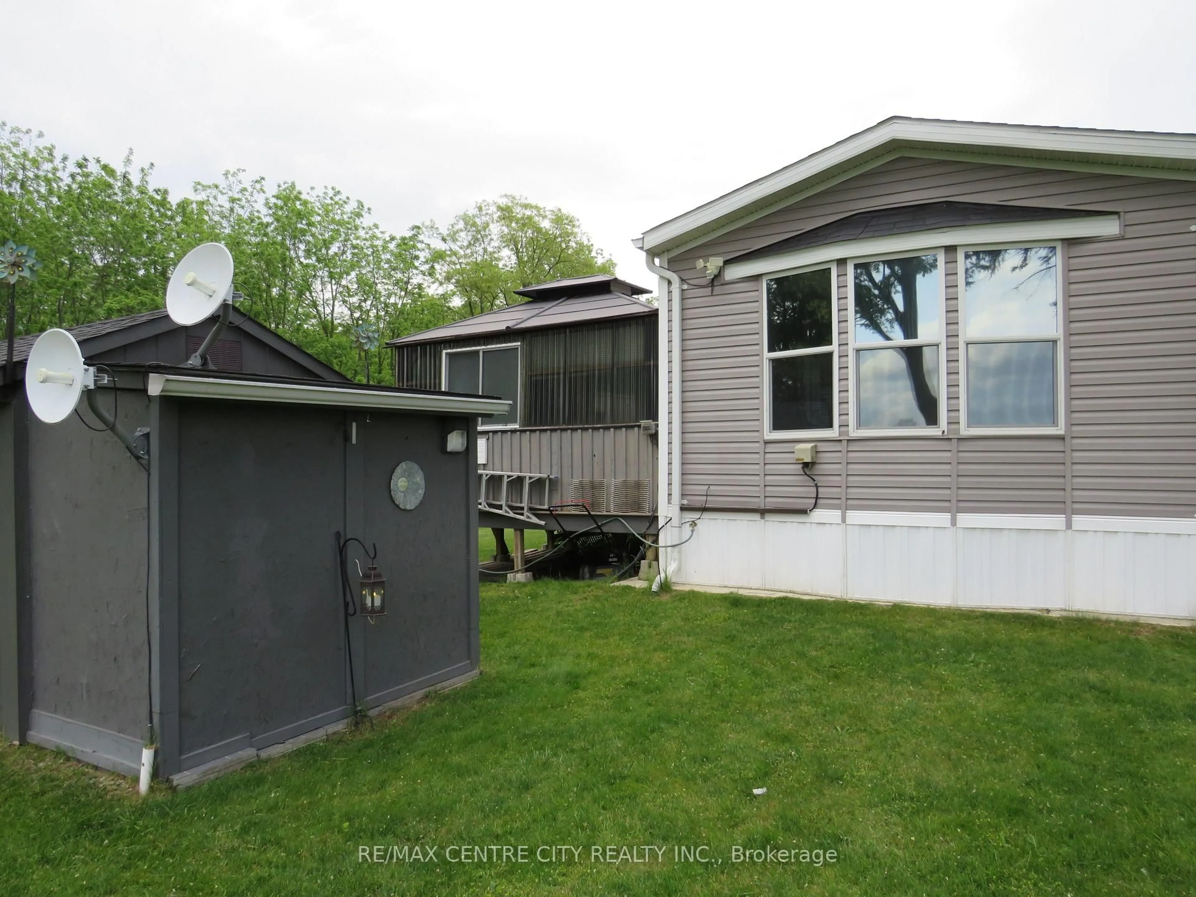 Home with vinyl exterior material, street for 15895 Longwoods Rd #106, Chatham-Kent Ontario N0P 1C0