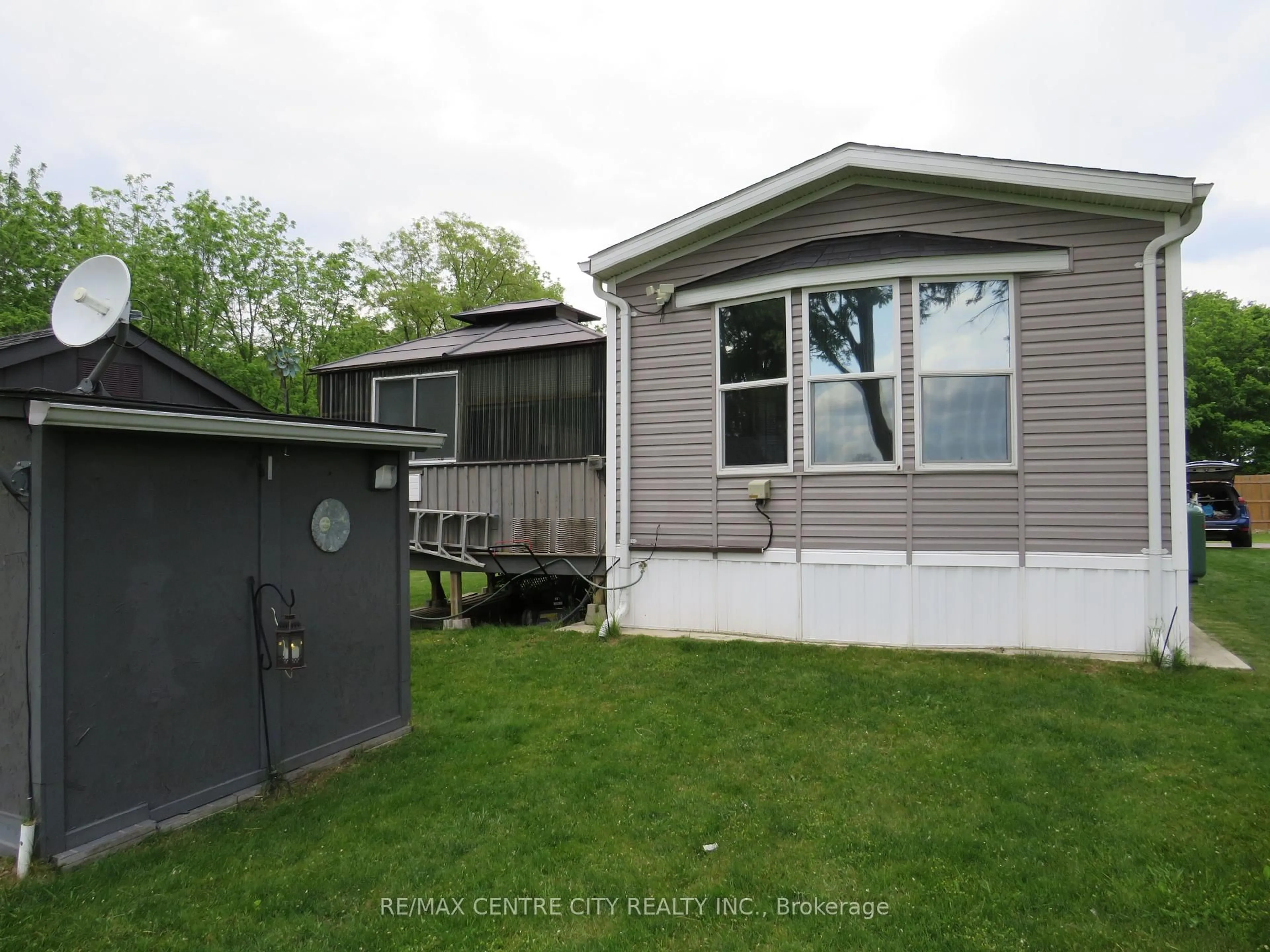 Home with vinyl exterior material, street for 15895 Longwoods Rd #106, Chatham-Kent Ontario N0P 1C0