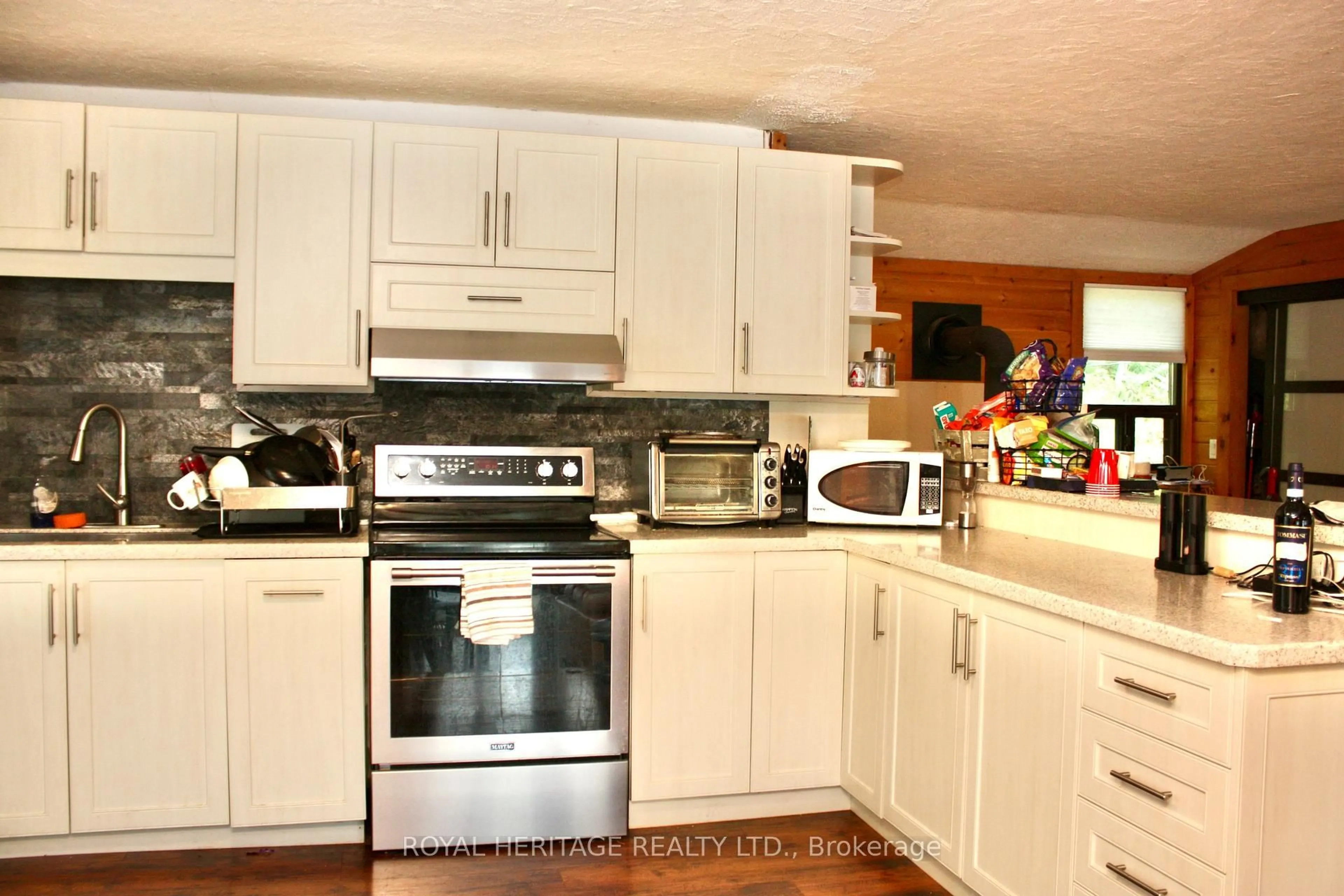 Open concept kitchen, wood/laminate floor for 388 Island 38, Havelock-Belmont-Methuen Ontario K0L 2H0