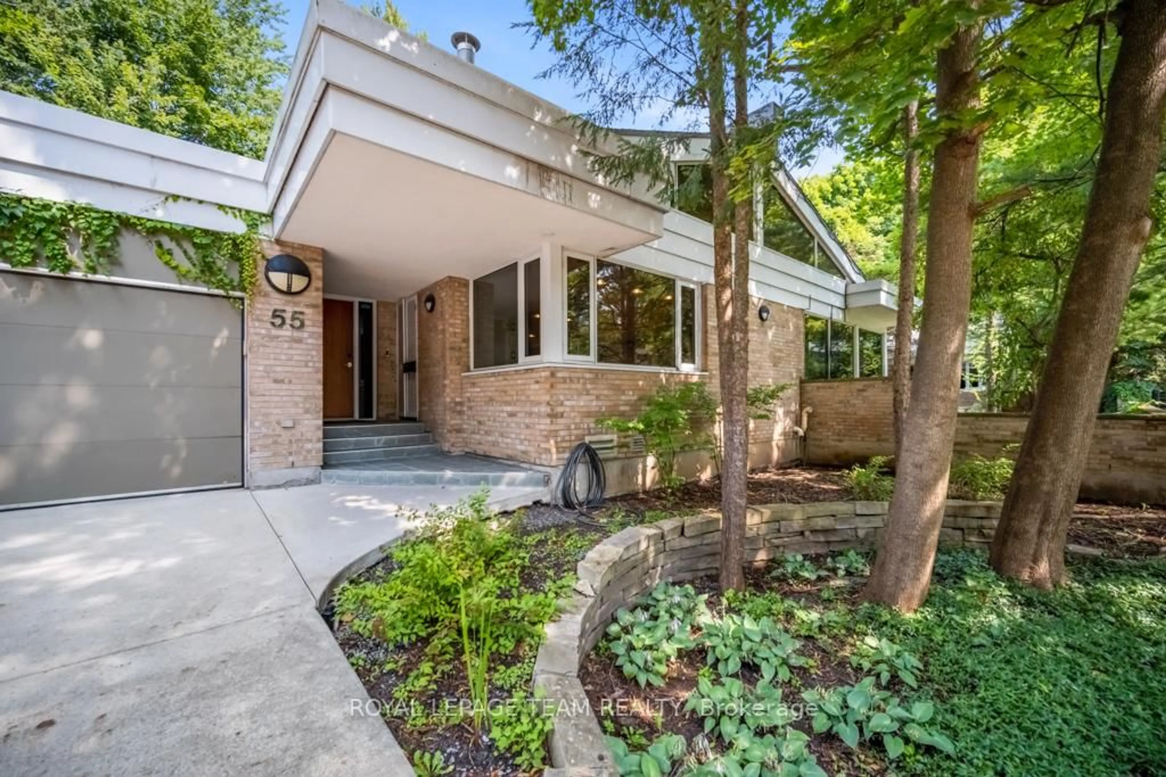 Home with brick exterior material, street for 55 WILLINGDON Rd, Ottawa Ontario K1M 2J6