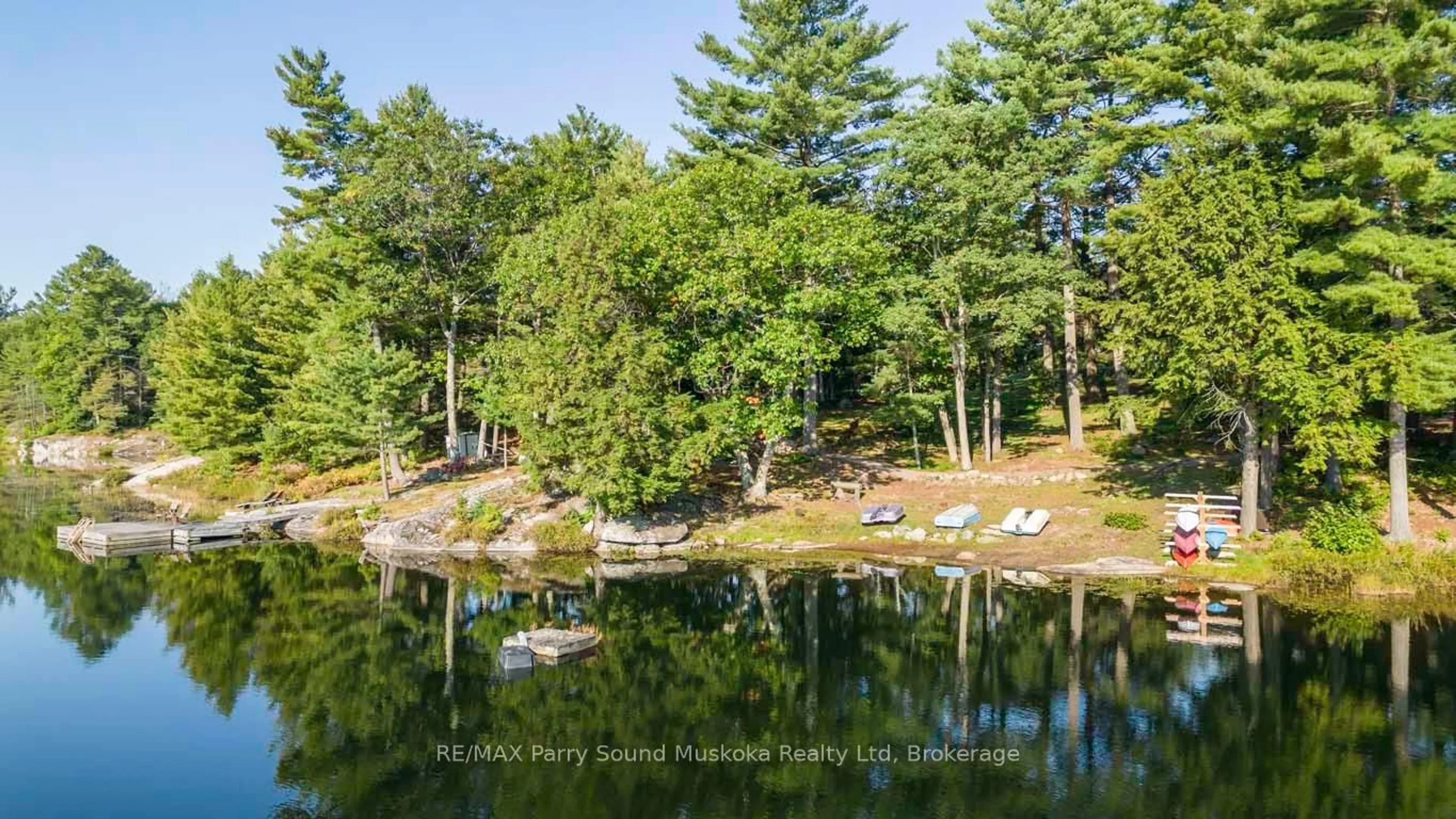 A pic from outside/outdoor area/front of a property/back of a property/a pic from drone, water/lake/river/ocean view for 57 10th Concession Rd, Seguin Ontario P2A 2W8