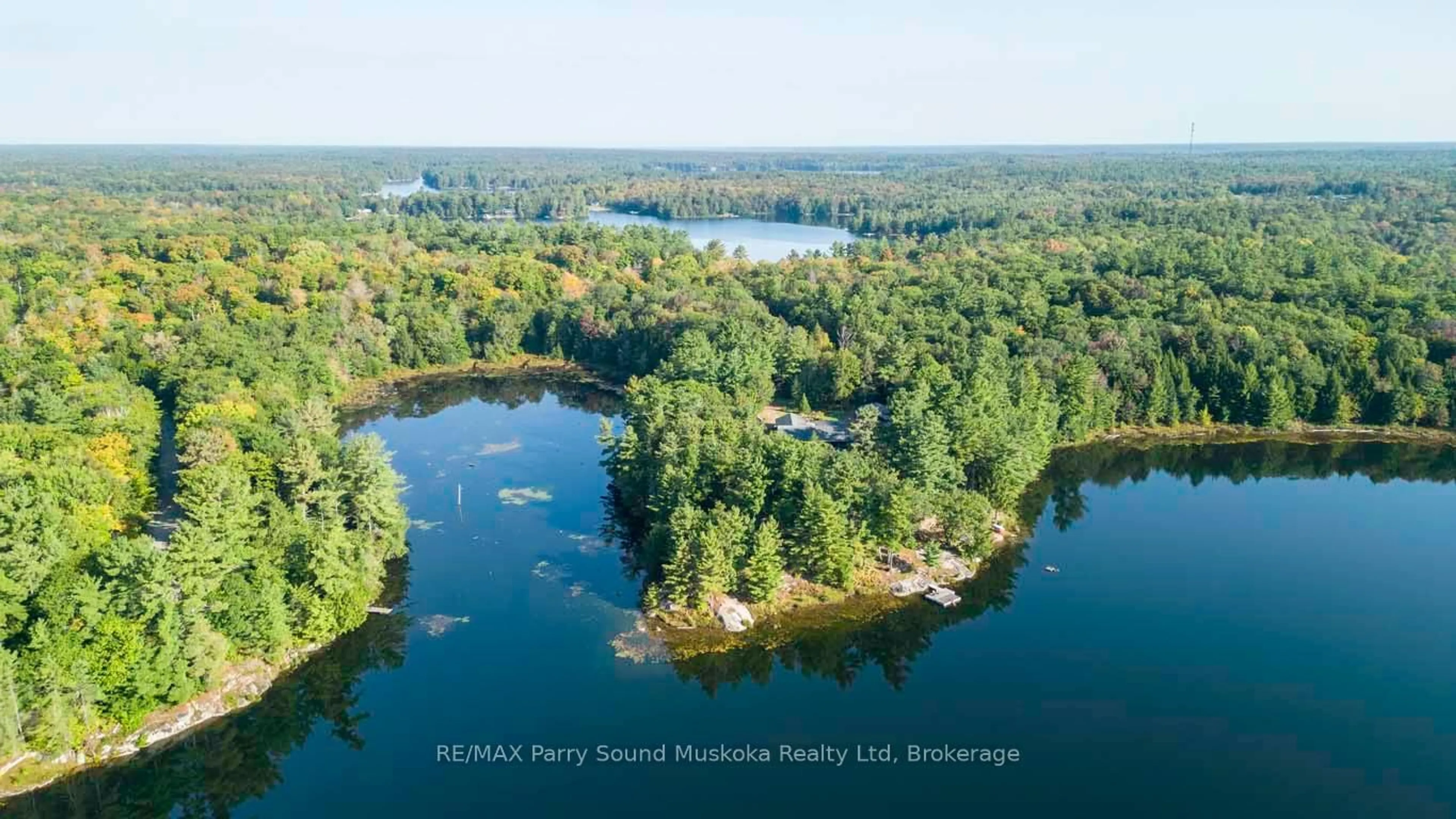 A pic from outside/outdoor area/front of a property/back of a property/a pic from drone, water/lake/river/ocean view for 57 10th Concession Rd, Seguin Ontario P2A 2W8