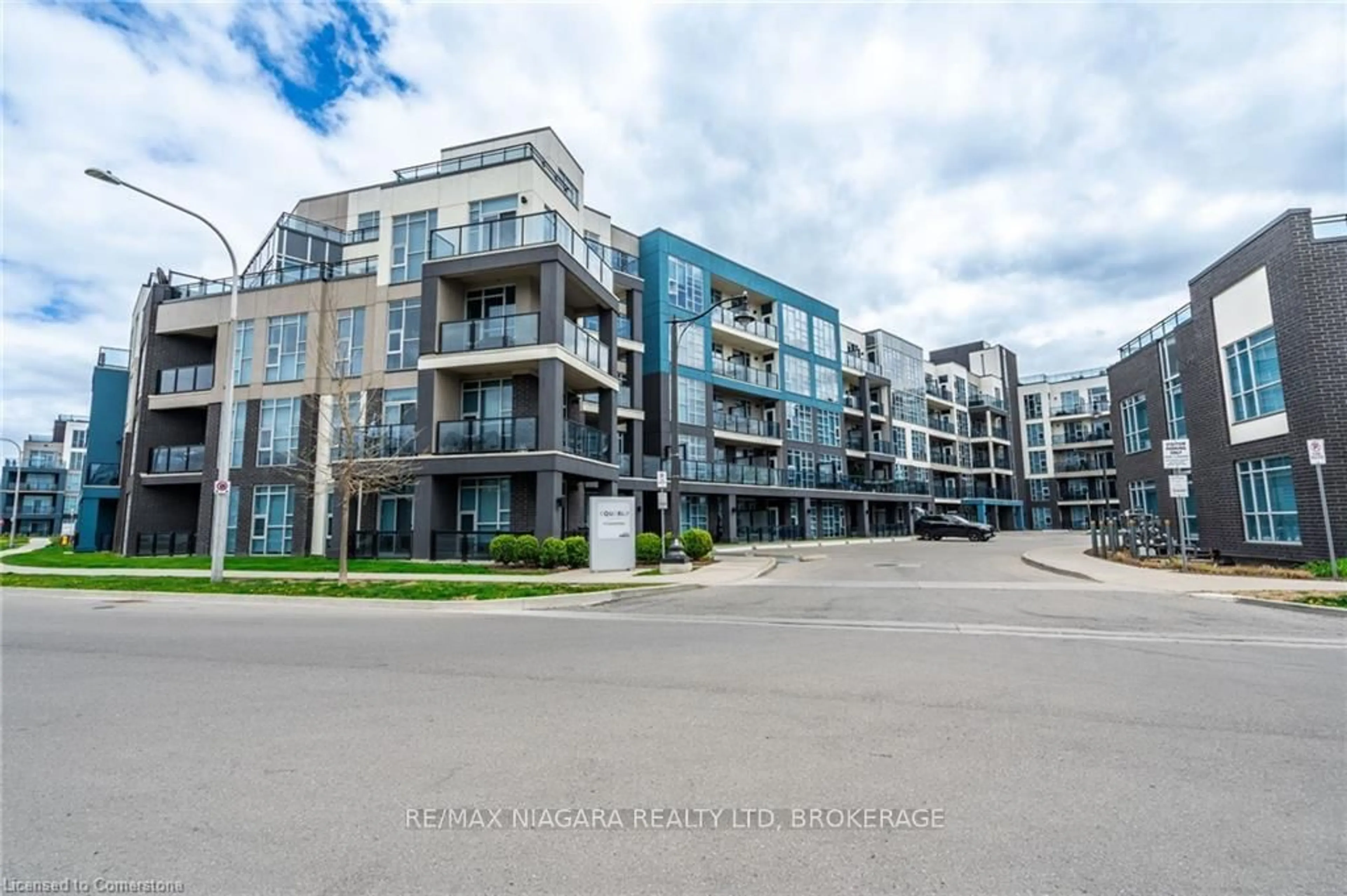 A pic from outside/outdoor area/front of a property/back of a property/a pic from drone, street for 10 Concord Pl #106, Grimsby Ontario L3M 0G6
