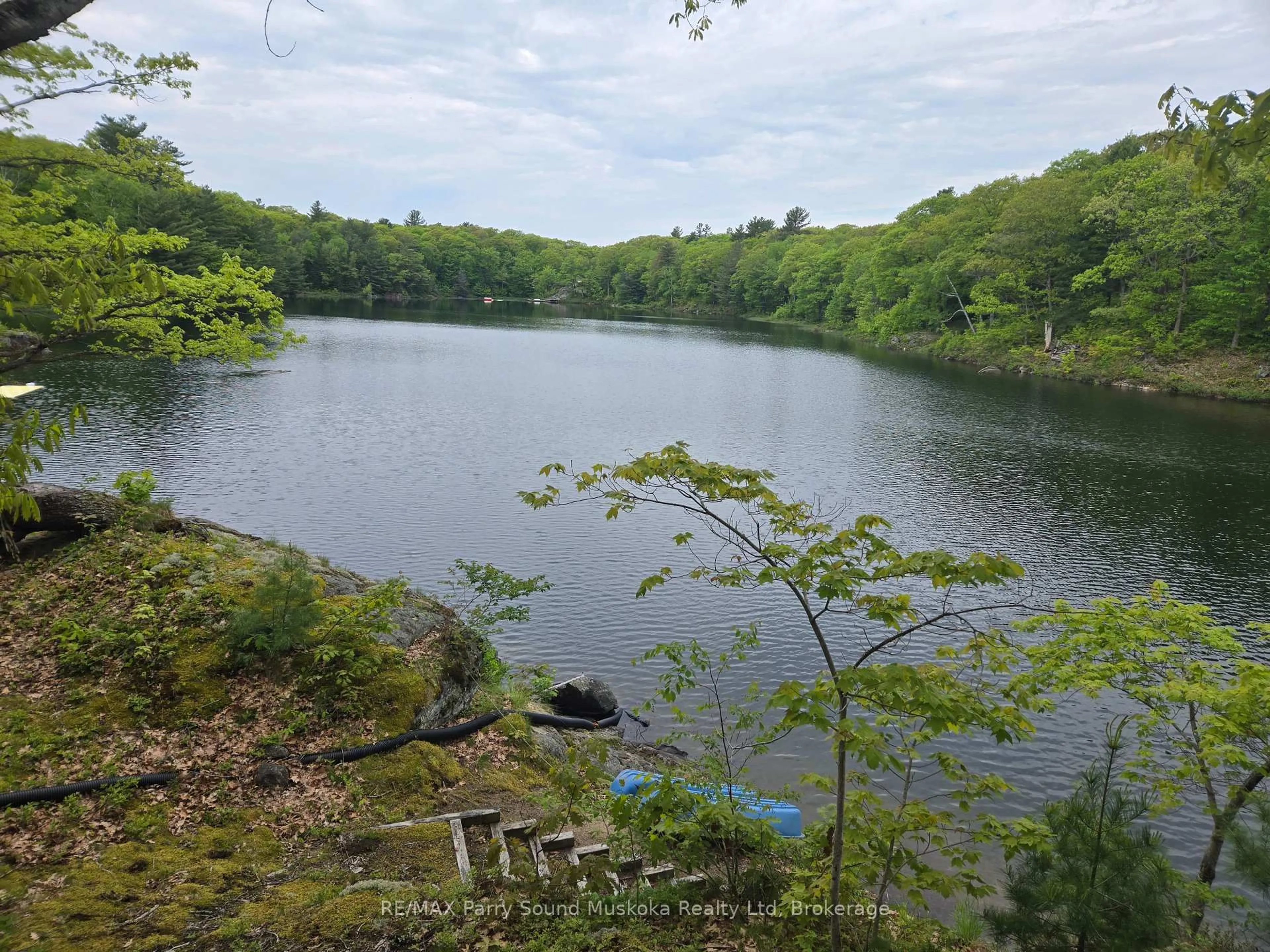 A pic from outside/outdoor area/front of a property/back of a property/a pic from drone, water/lake/river/ocean view for 7 Stata Lane, Seguin Ontario P2A 2W8