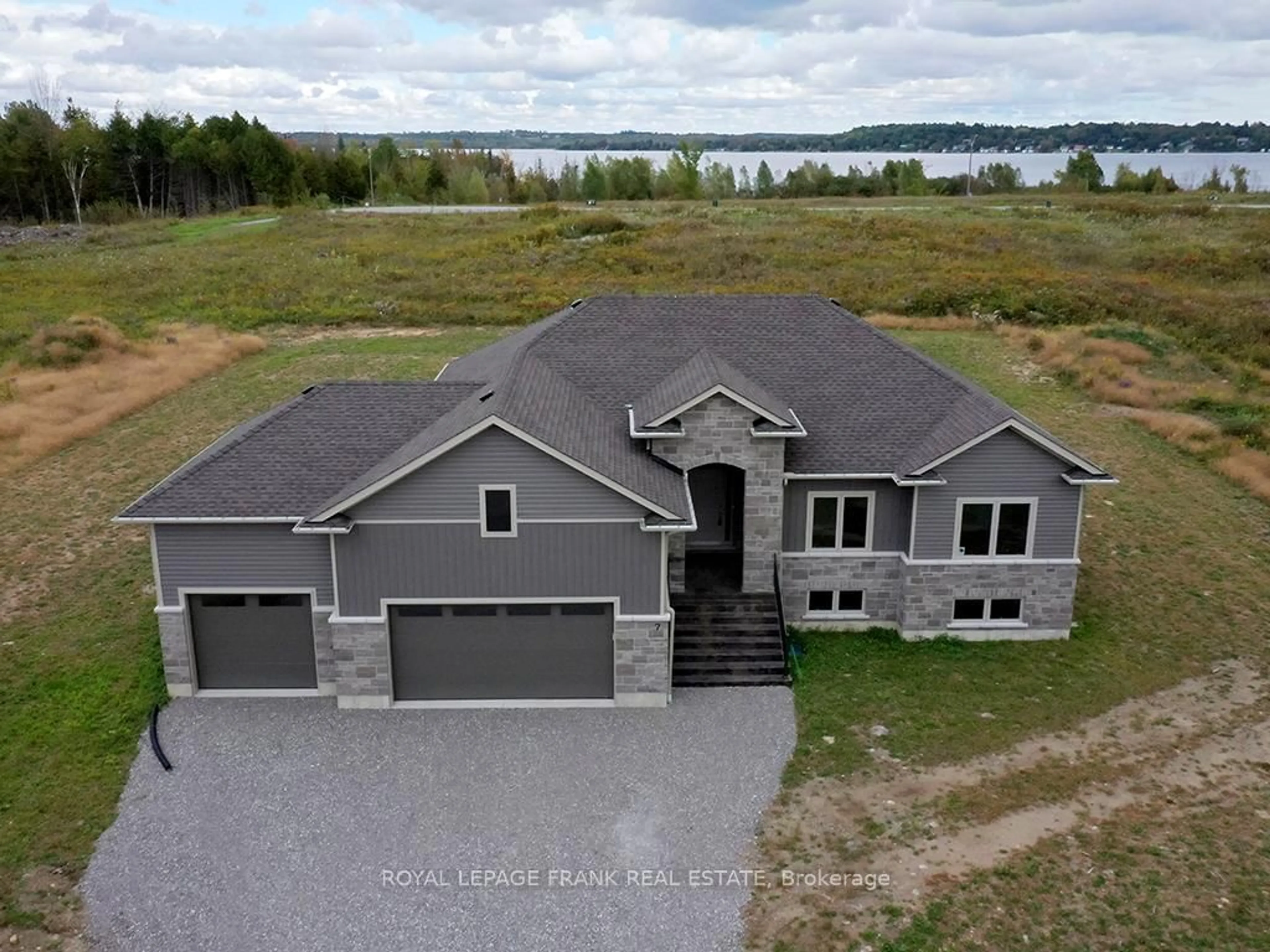 A pic from outside/outdoor area/front of a property/back of a property/a pic from drone, water/lake/river/ocean view for 7 Nipigon St, Kawartha Lakes Ontario K0M 1N0