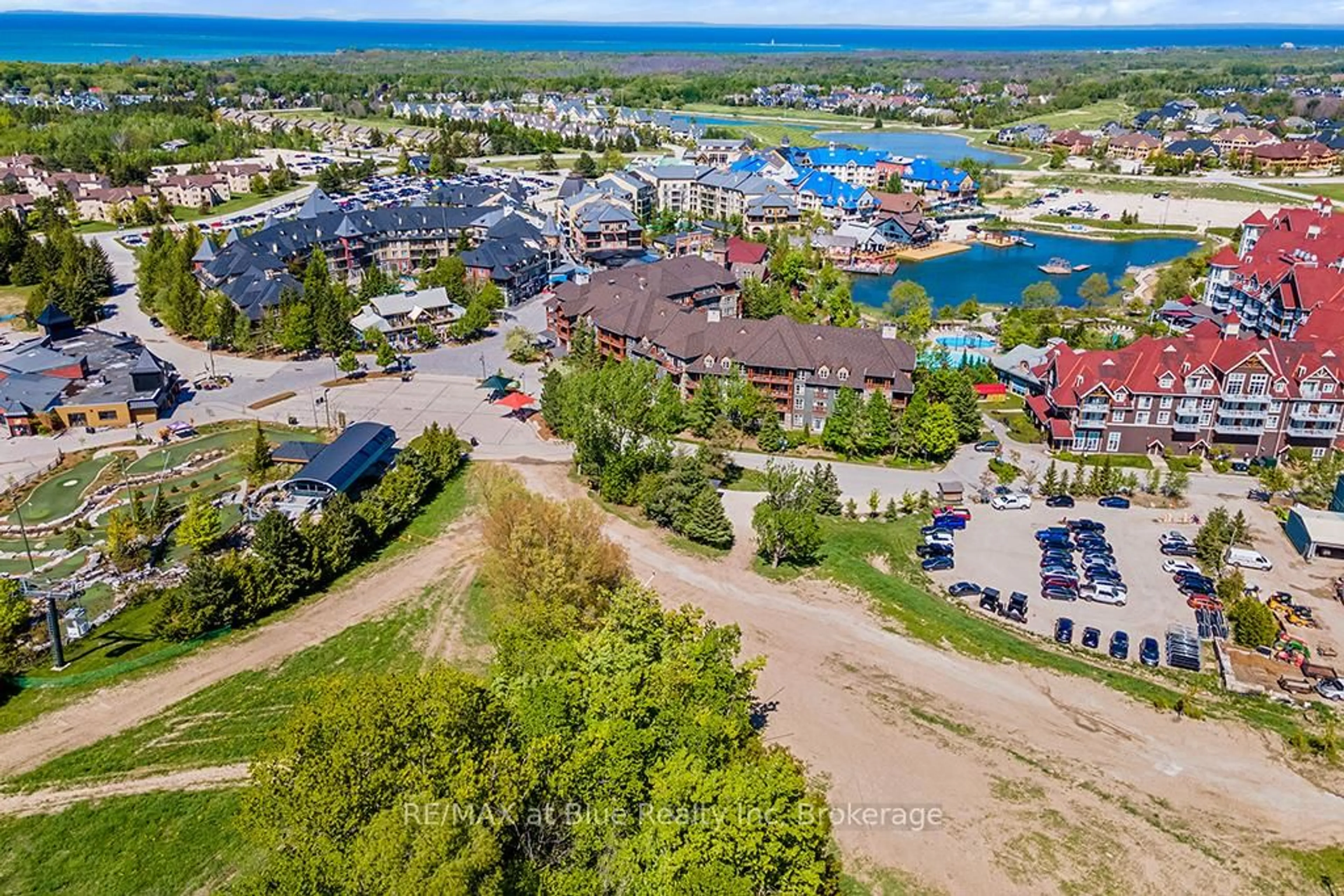 A pic from outside/outdoor area/front of a property/back of a property/a pic from drone, water/lake/river/ocean view for 152 Jozo Weider Blvd #326, Blue Mountains Ontario L9Y 0V2