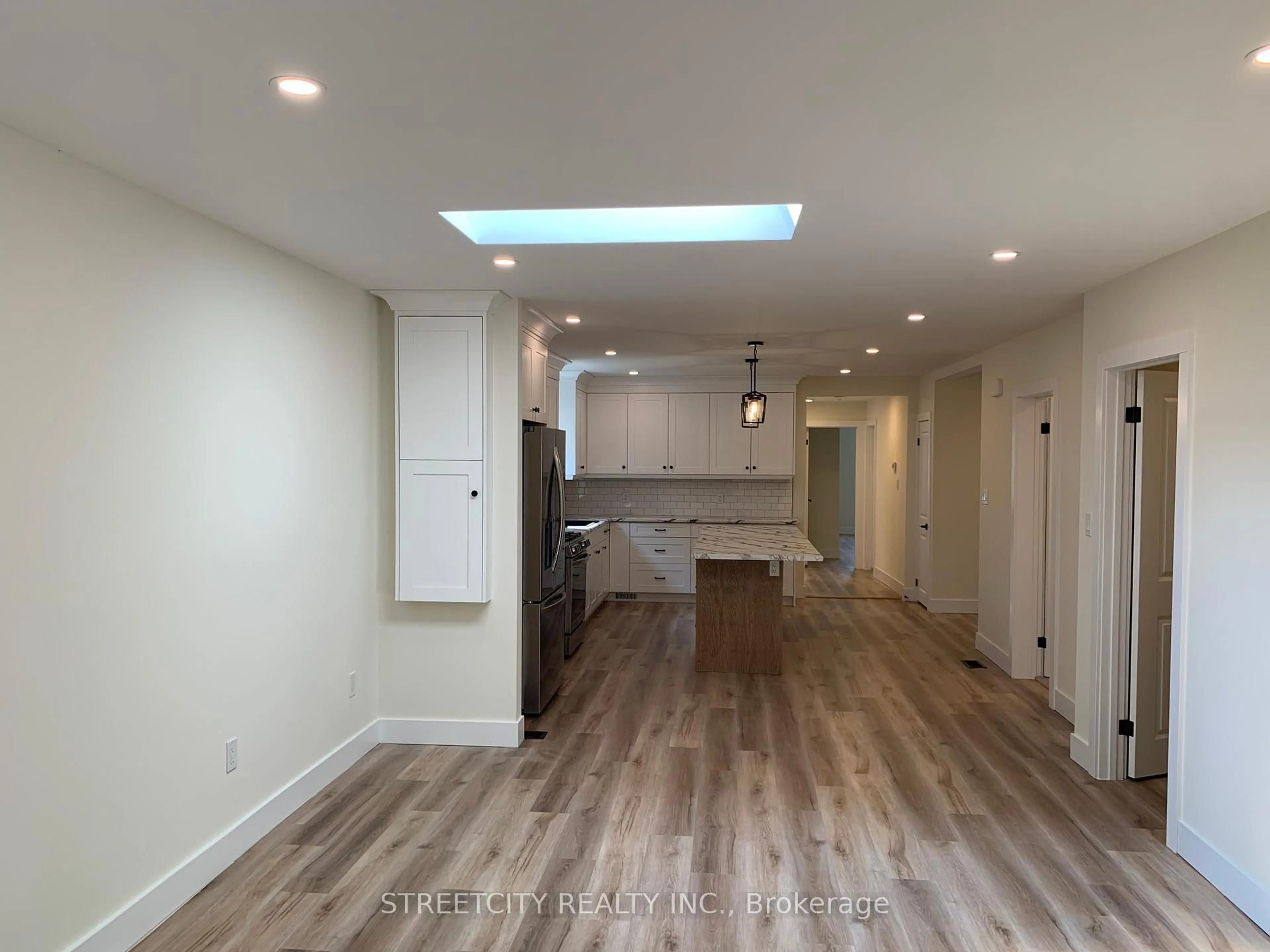 Open concept kitchen, wood/laminate floor for 481 Gold St, Warwick Ontario N0M 0B9