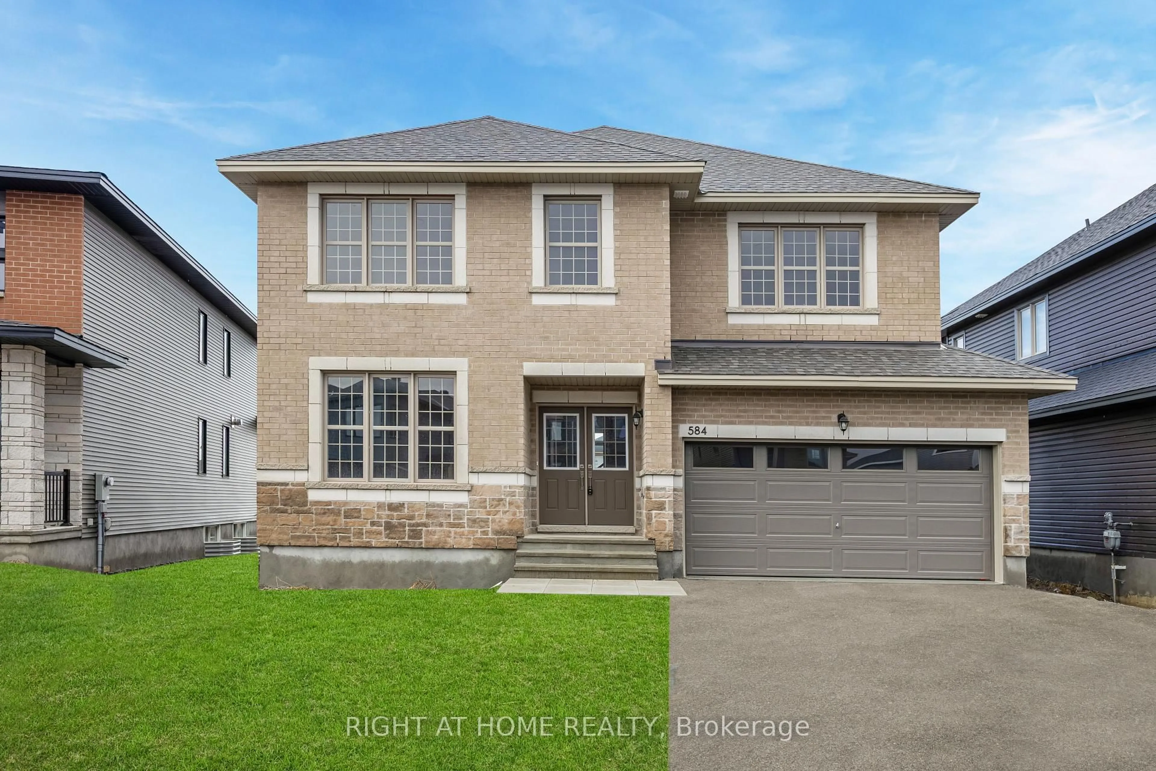 Home with vinyl exterior material, street for 584 Paakanaak Ave, Ottawa Ontario K1X 0J6