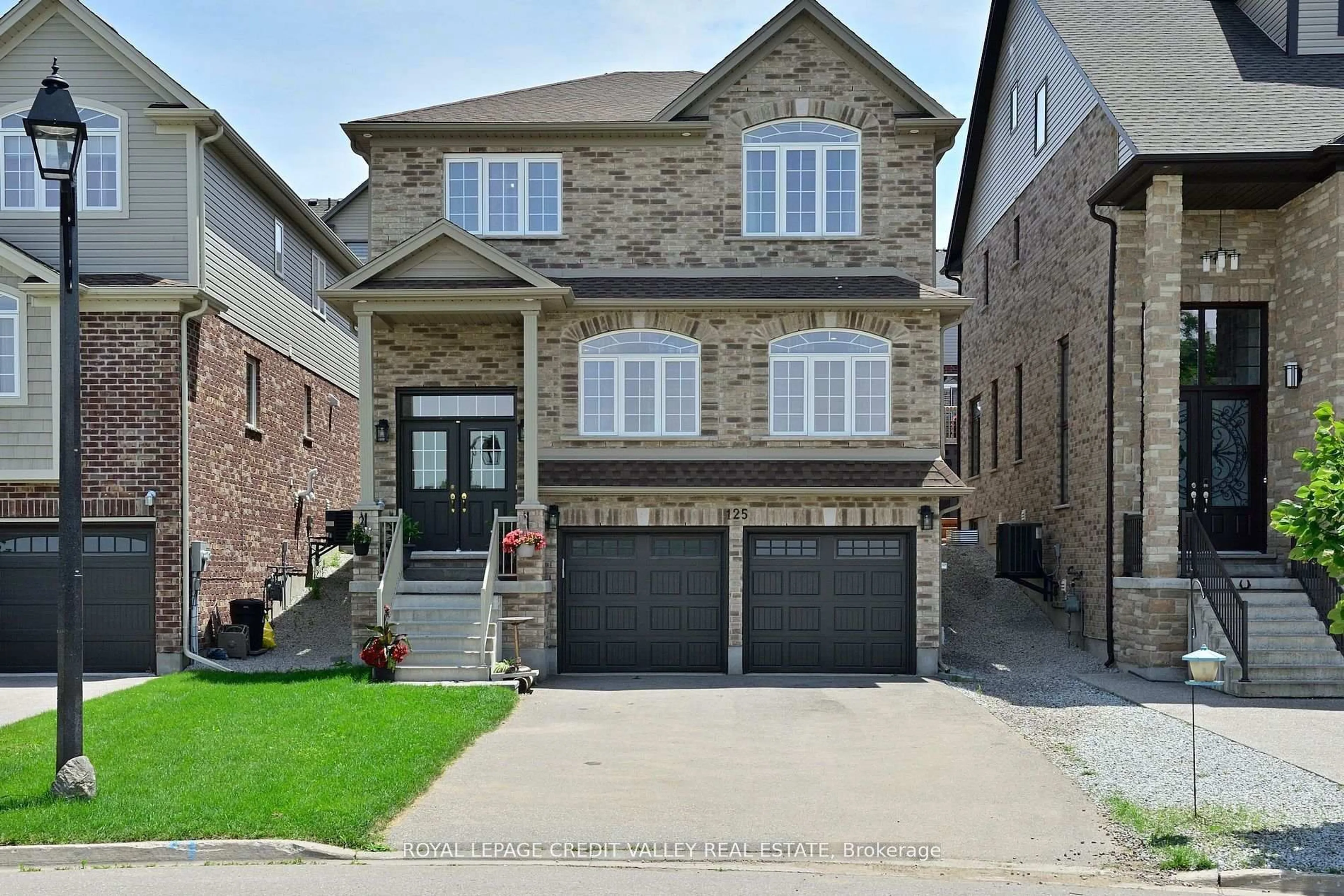 Home with brick exterior material, street for 125 Gagnon Pl, Guelph/Eramosa Ontario N0B 2K0
