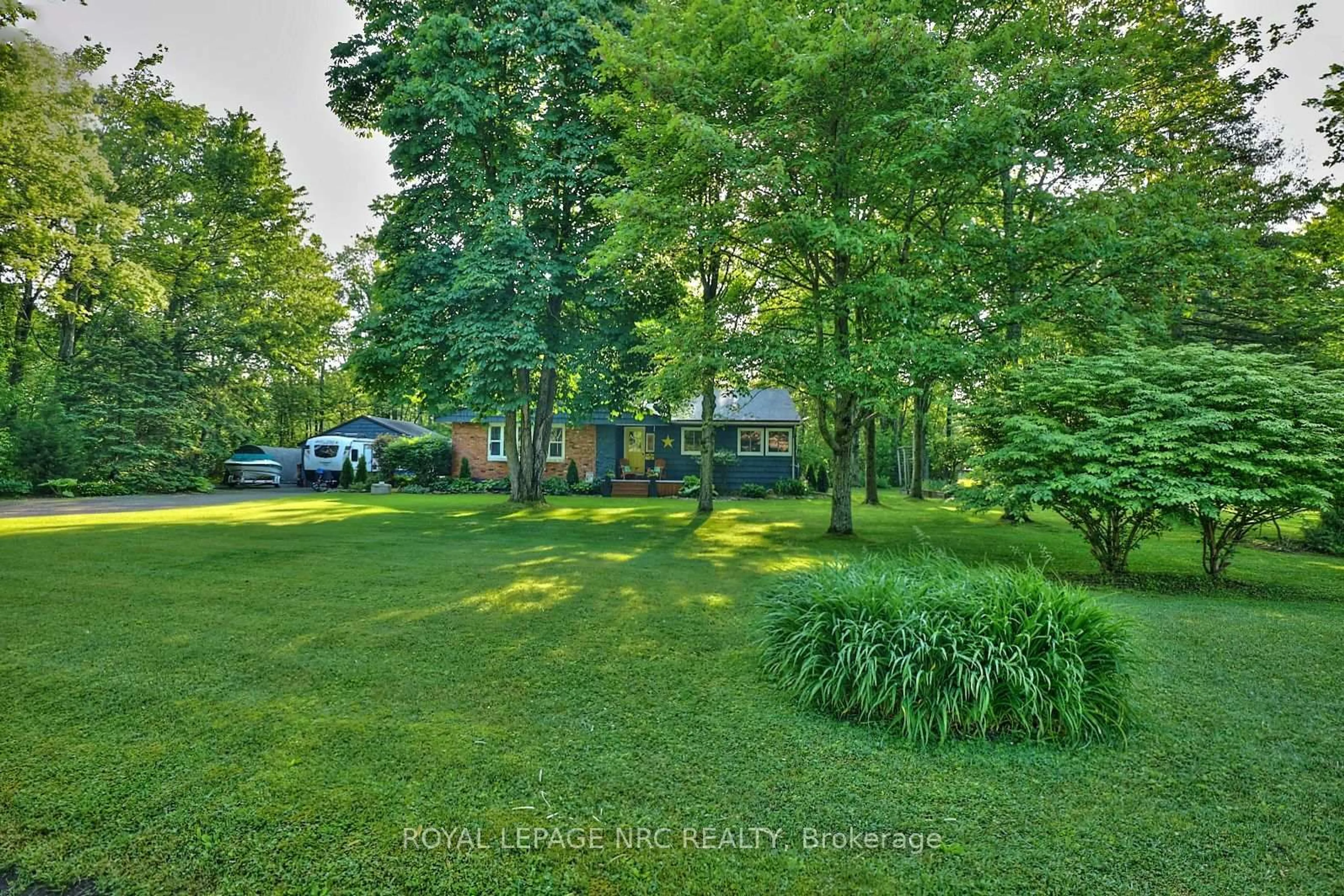 A pic from outside/outdoor area/front of a property/back of a property/a pic from drone, forest/trees view for 599 Wyldewood Rd, Port Colborne Ontario L0S 1R0