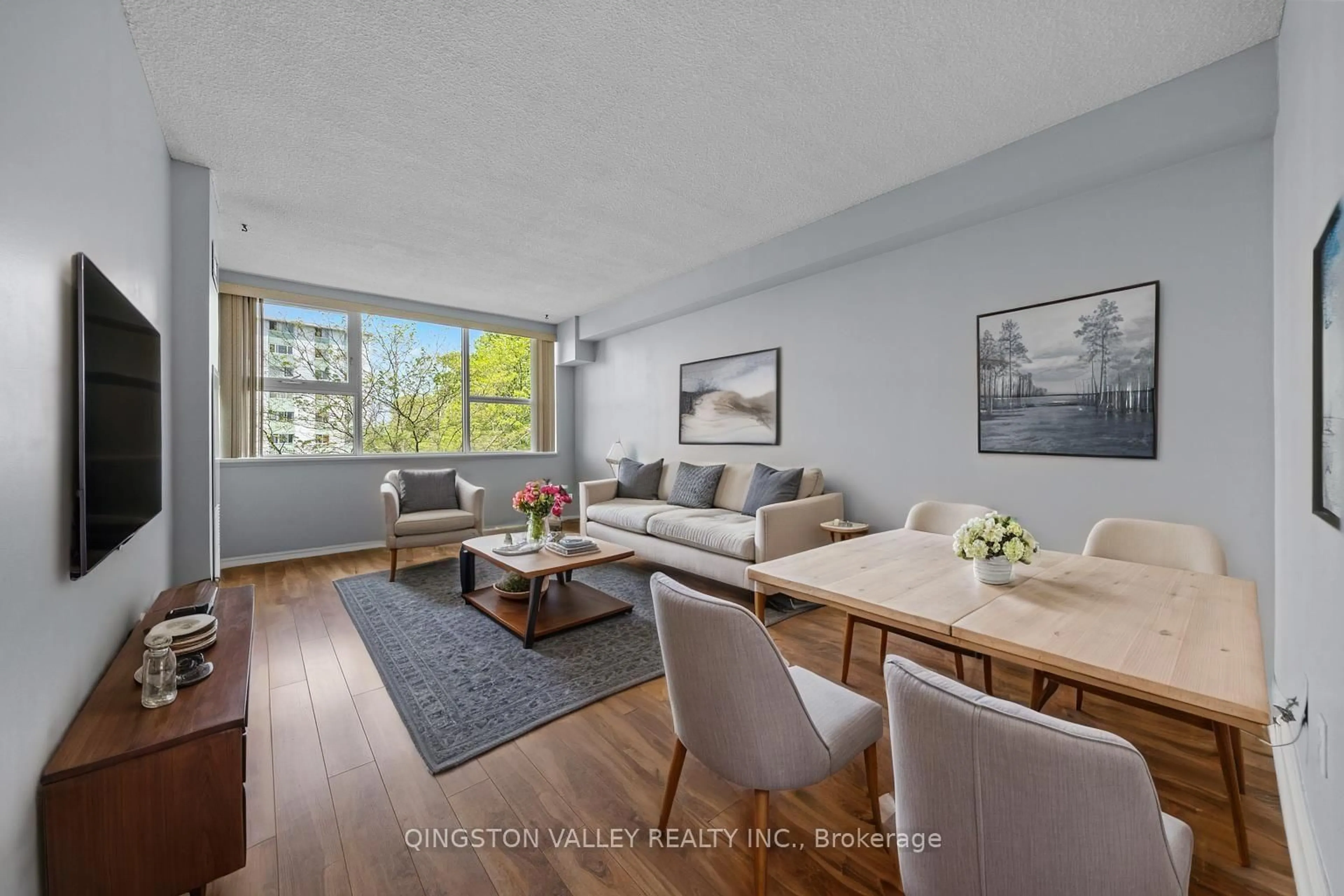 Living room with furniture, wood/laminate floor for 555 BRITTANY Dr #404, Ottawa Ontario K1K 4C5