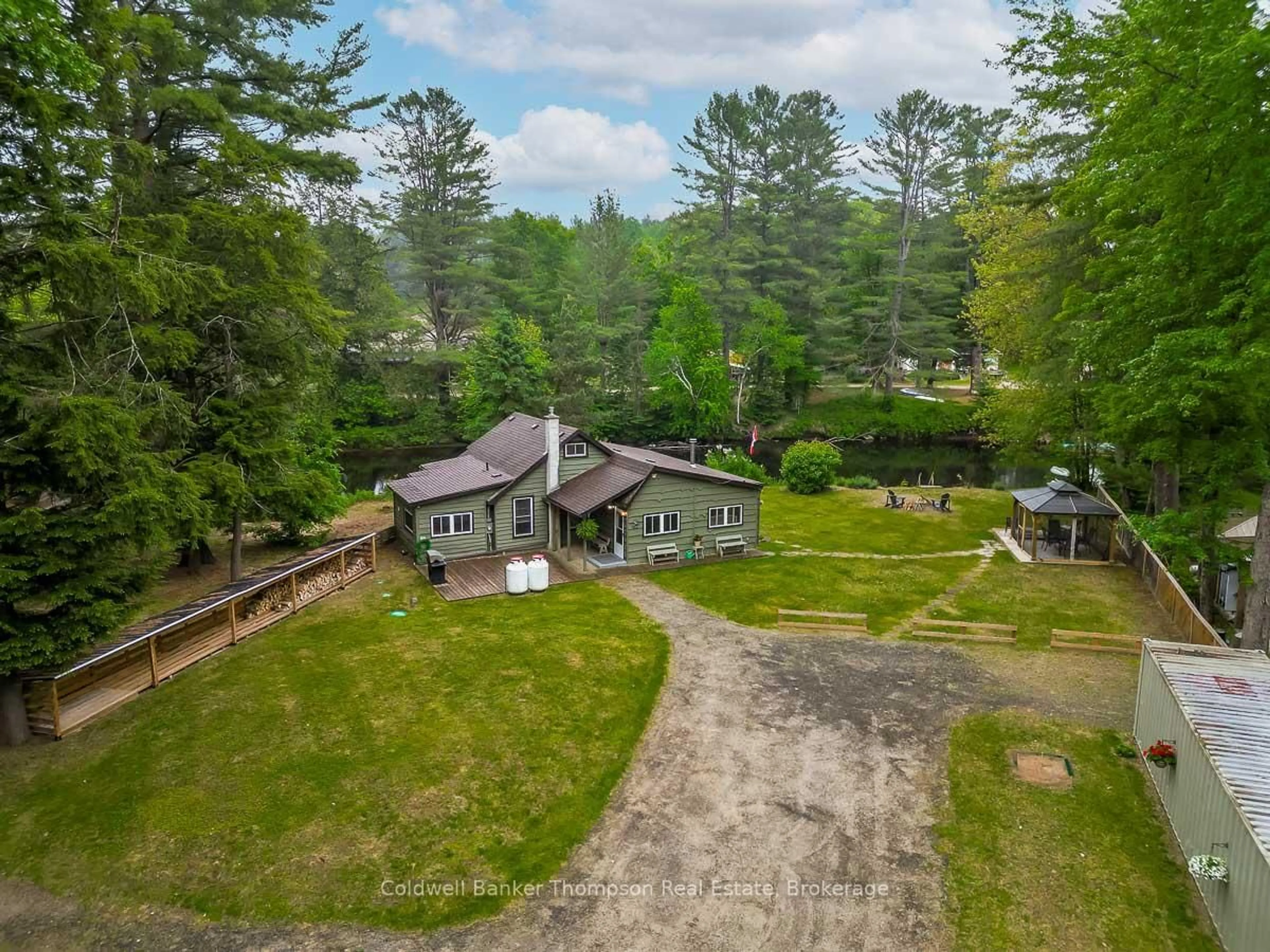 A pic from outside/outdoor area/front of a property/back of a property/a pic from drone, unknown for 60 Bridgeview Lane, Huntsville Ontario P1H 2N5