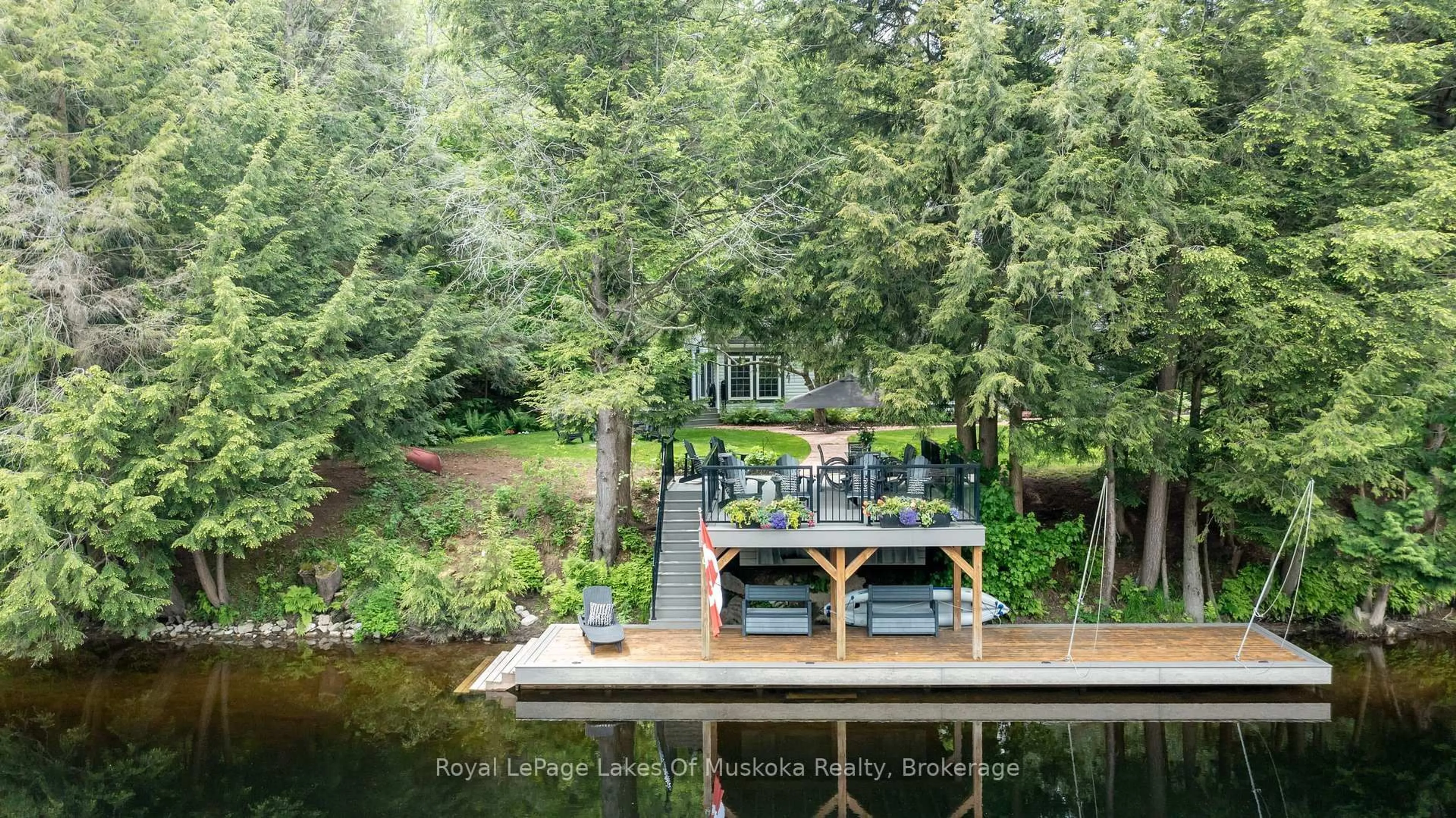 A pic from outside/outdoor area/front of a property/back of a property/a pic from drone, water/lake/river/ocean view for 103 Southbank Dr, Bracebridge Ontario P1L 1G3