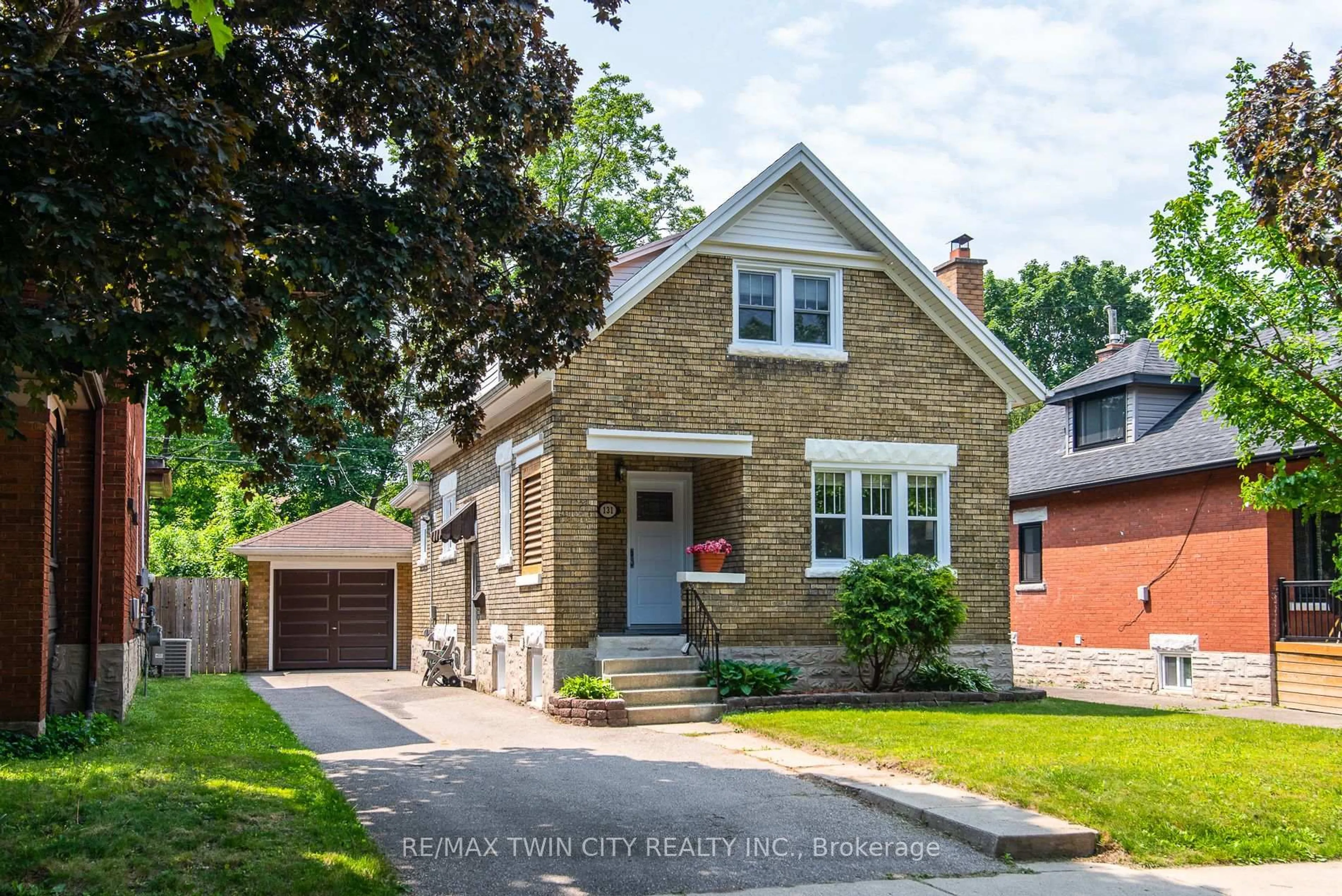 Home with brick exterior material, street for 131 Homewood Ave, Kitchener Ontario N2M 1X1