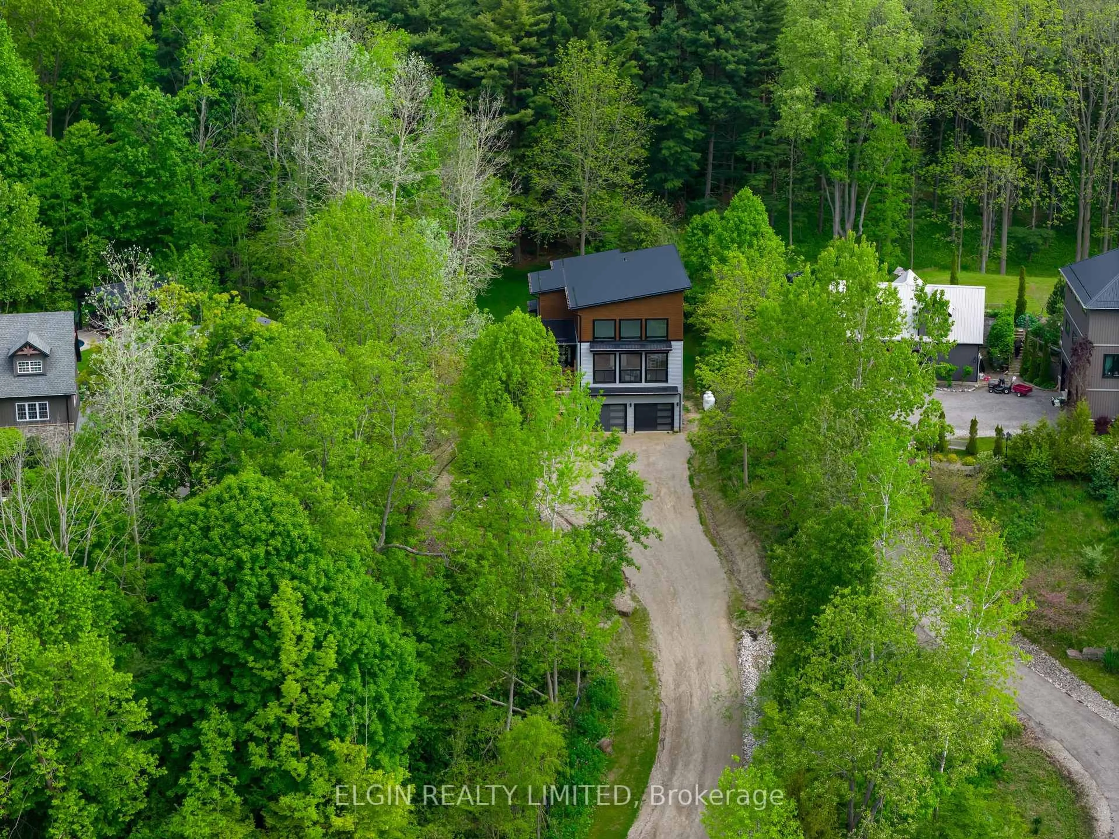 A pic from outside/outdoor area/front of a property/back of a property/a pic from drone, forest/trees view for 4132 Thomas Rd, Southwold Ontario N5L 1J2